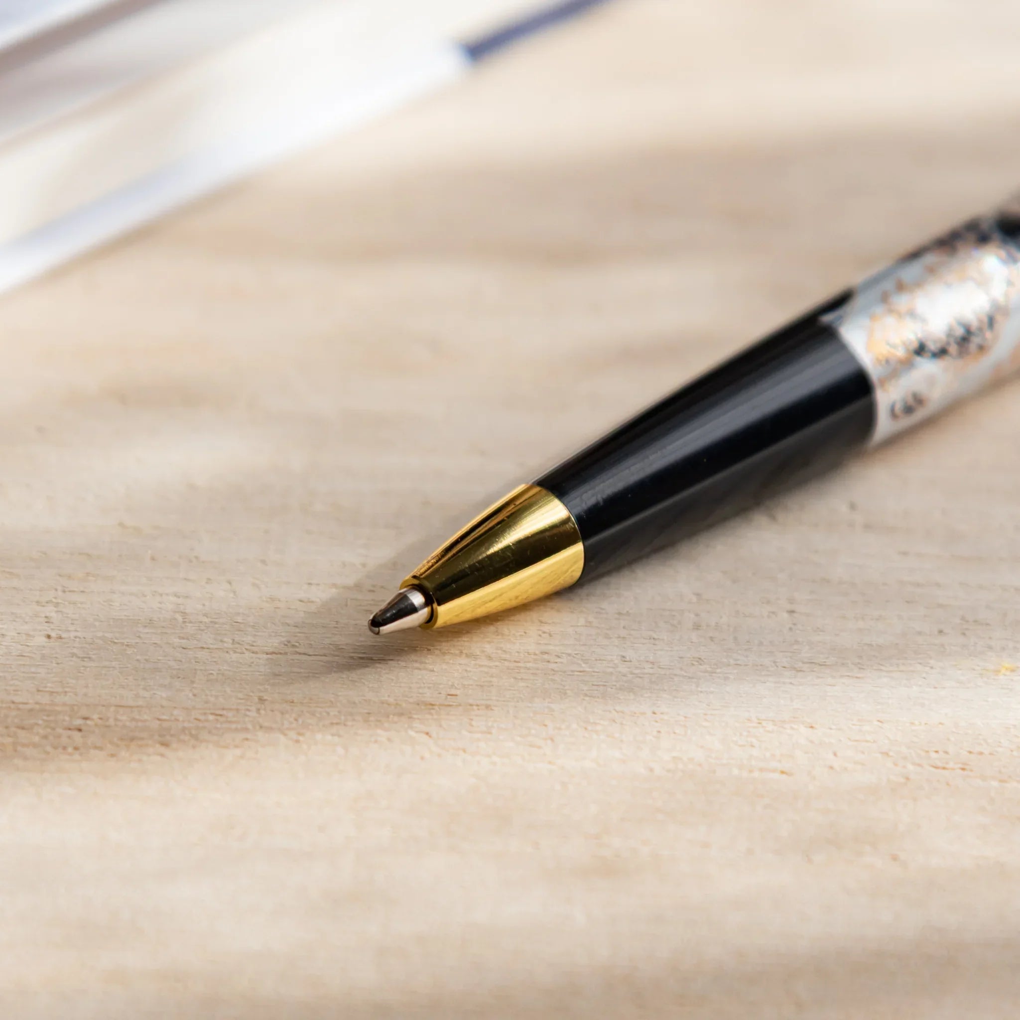 Yamanaka pen at angle showing Great Wave artwork on barrel surface detail and composition in composition