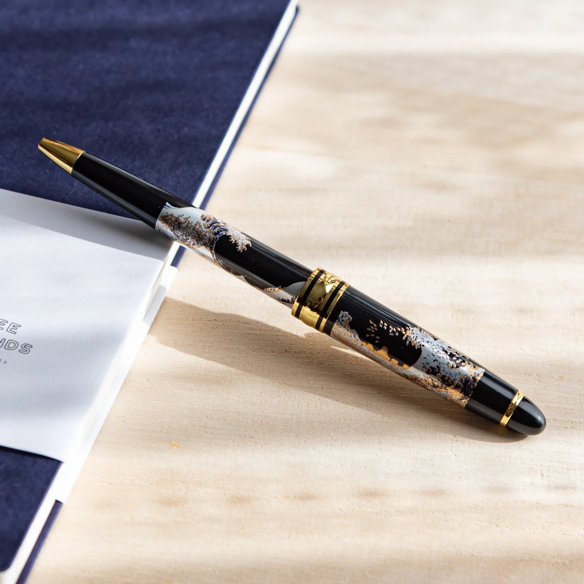 Retractable pen detail showing Great Wave landscape composition and design displayed clearly composition
