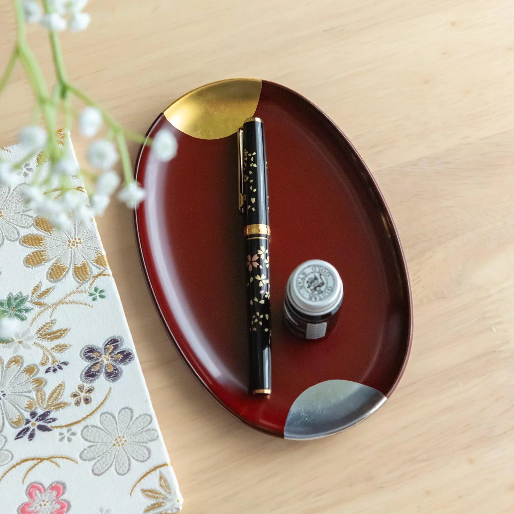 Traditional Japanese Echizen red lacquer pen tray features sun and moon celestial artwork design, refined for organizing w