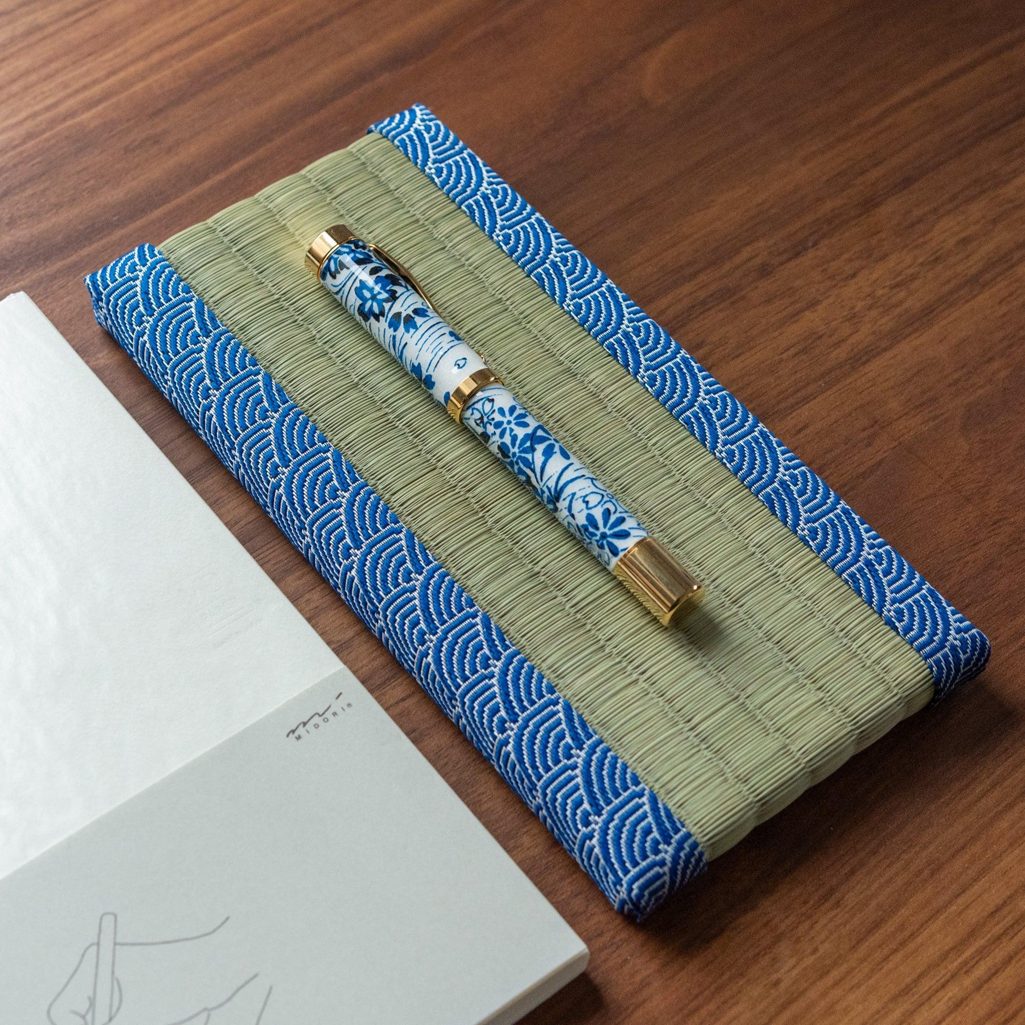 Overhead angled view of Blue Yachiyo tatami tray with blue and white fabric trim and two ceramic pens