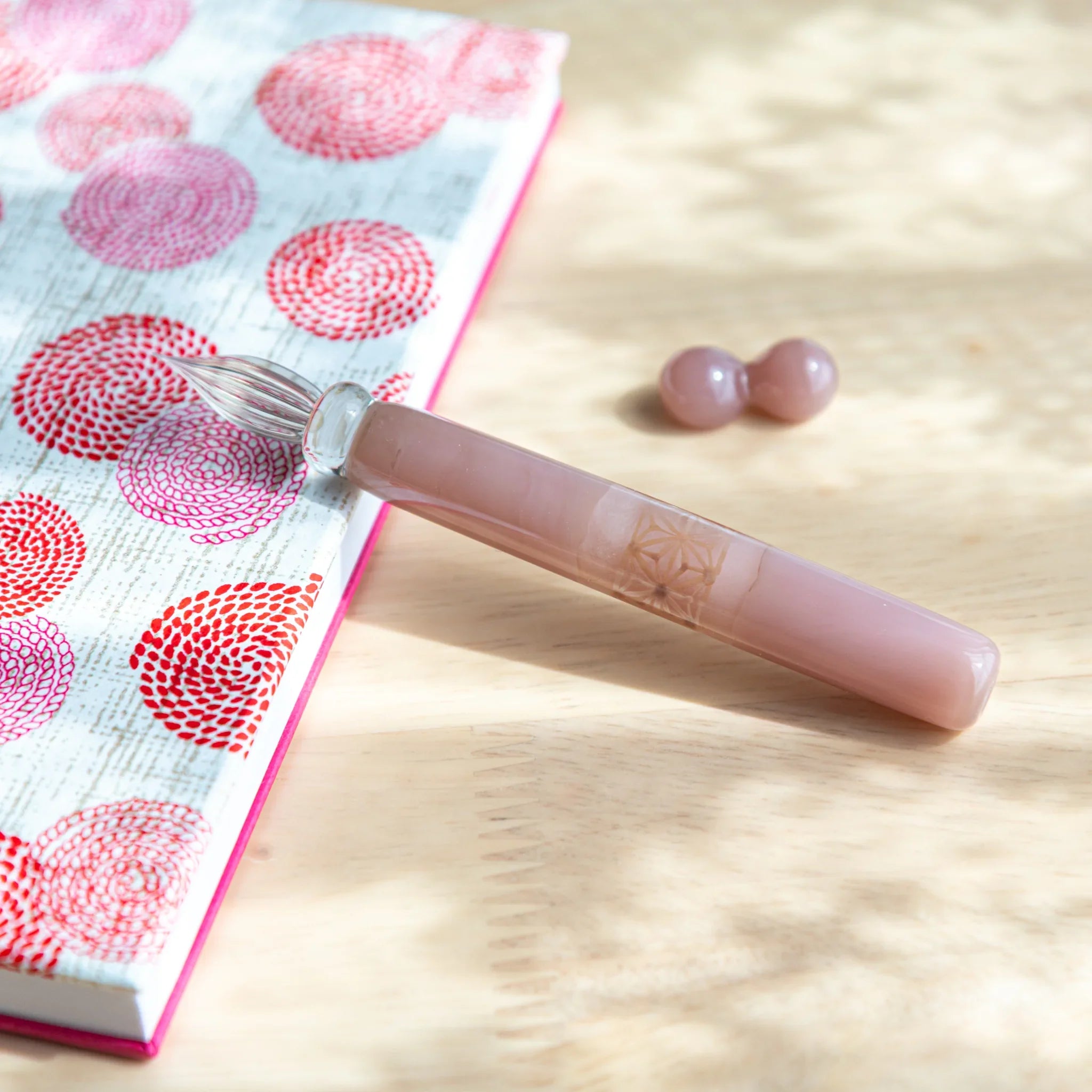 Blush pink glass dip pen with asa no ha hemp leaf pattern band and mauve wooden round pen rests included