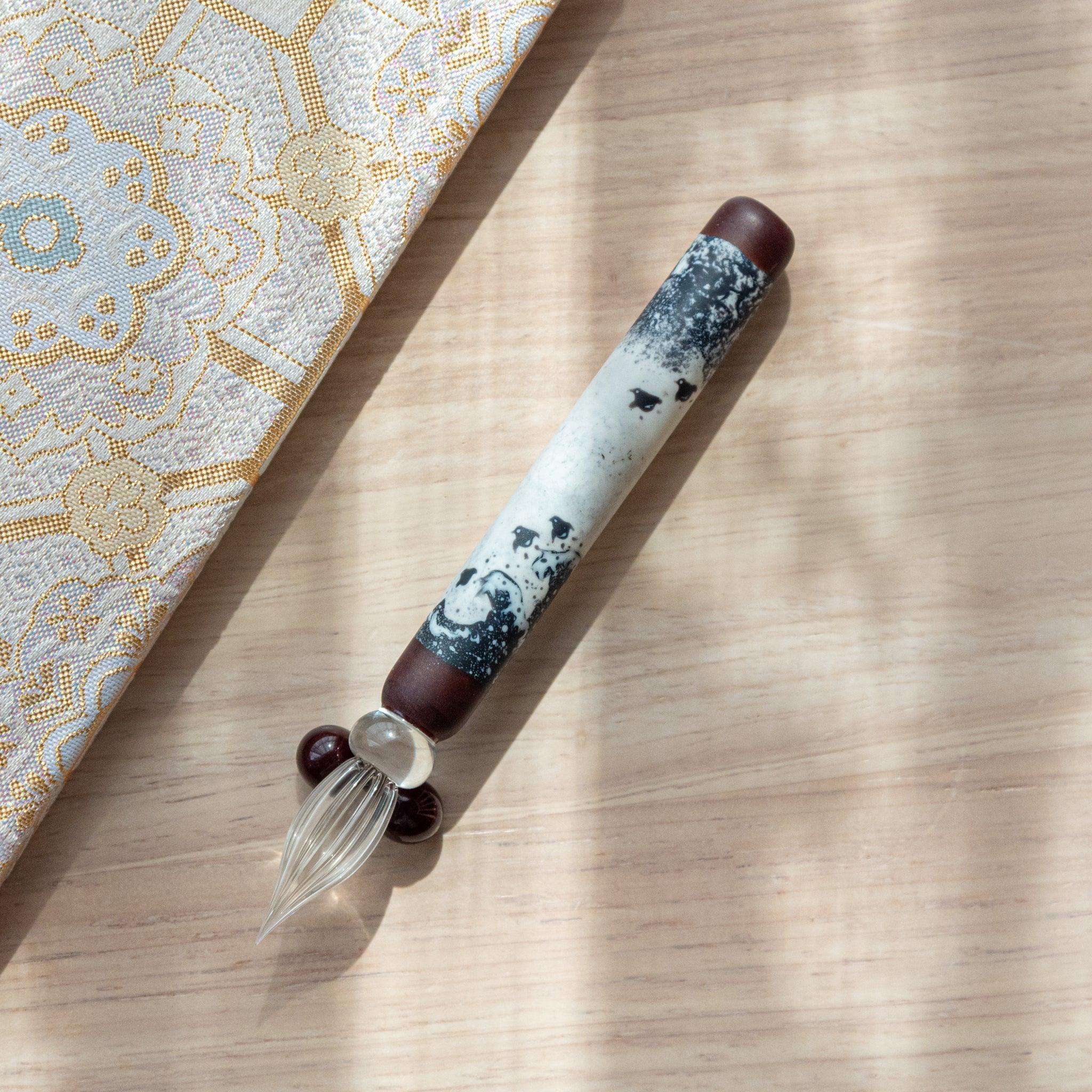 Glass dip pen featuring iconic Great Wave pattern with chidori birds, inspired by Japanese ukiyo-e art tradition