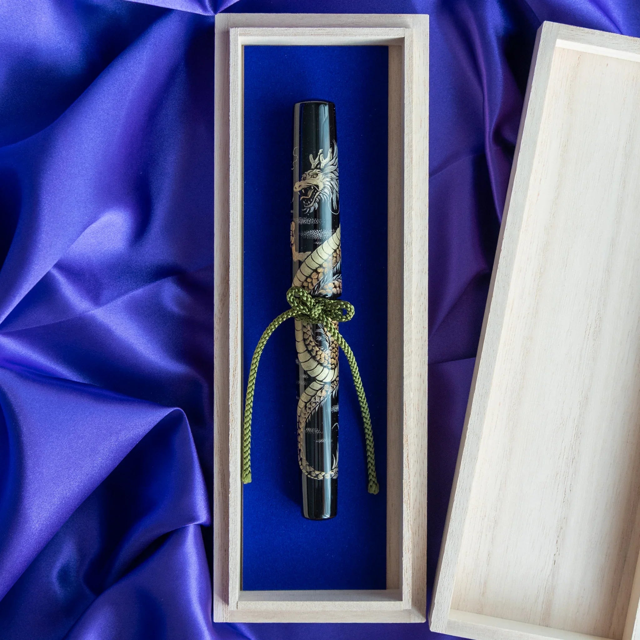 Chinkin Dragon Echizen lacquered fountain pen in wooden gift box with blue silk backing showing product quality and design