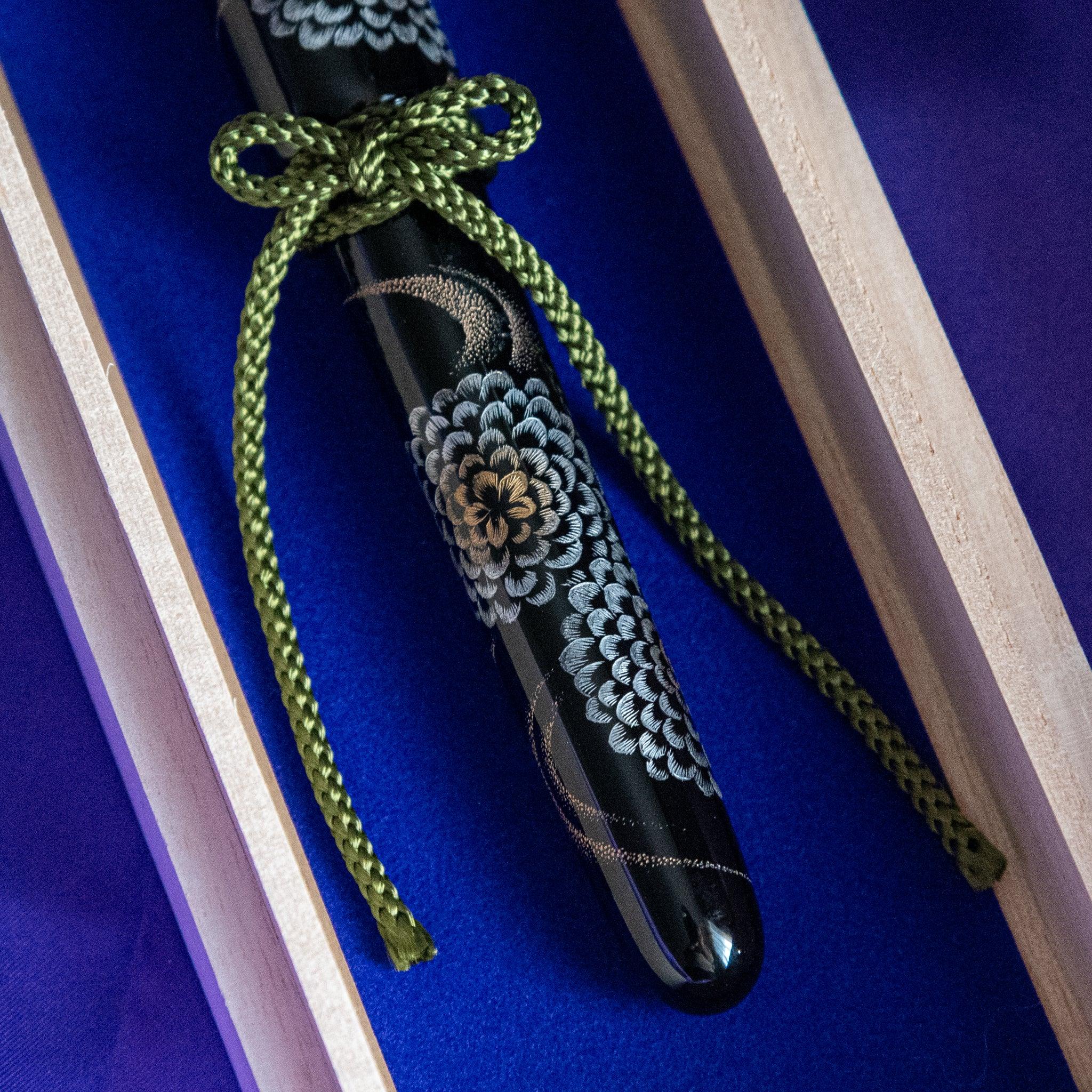 Wooden presentation box for Chinkin Kikusui fountain pen with coordinating fabric showing product quality and design details