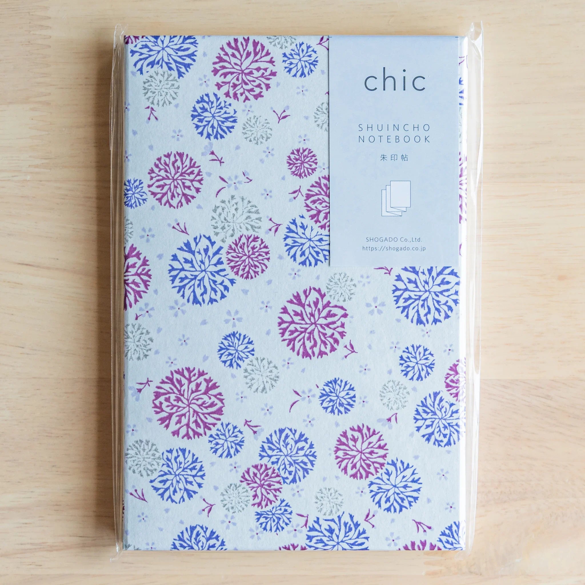 Chrysanthemum Harmony purple goshuincho displayed at angle showing binding and cover profile with decorative chrysanthemum