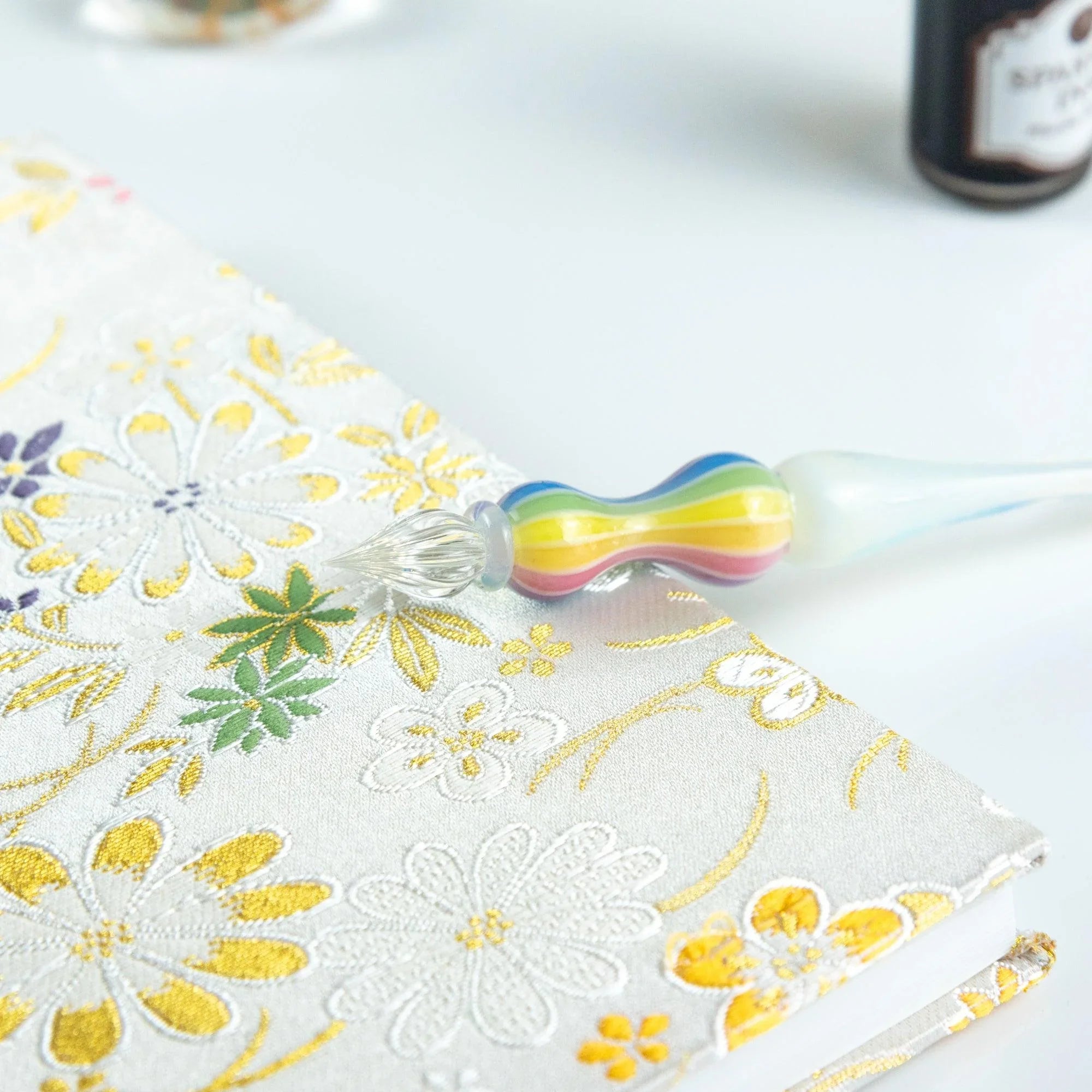 White glass dip pen with clear transparent balloon bulb showing clean minimalist glass craftsmanship