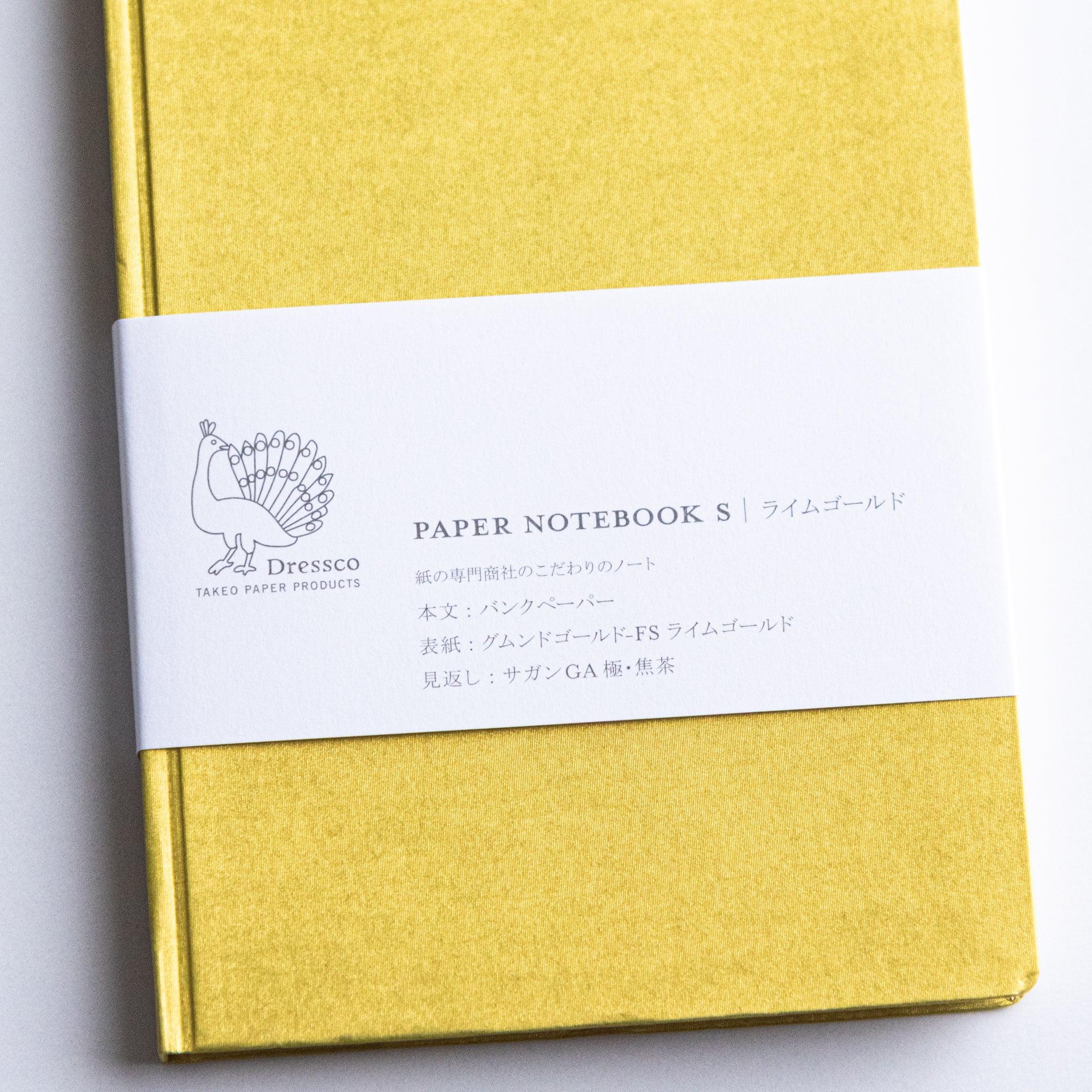Top-down flat lay of Dressco Bank Ledger Paper A6 notebook showing the full cover surface and A6 size format