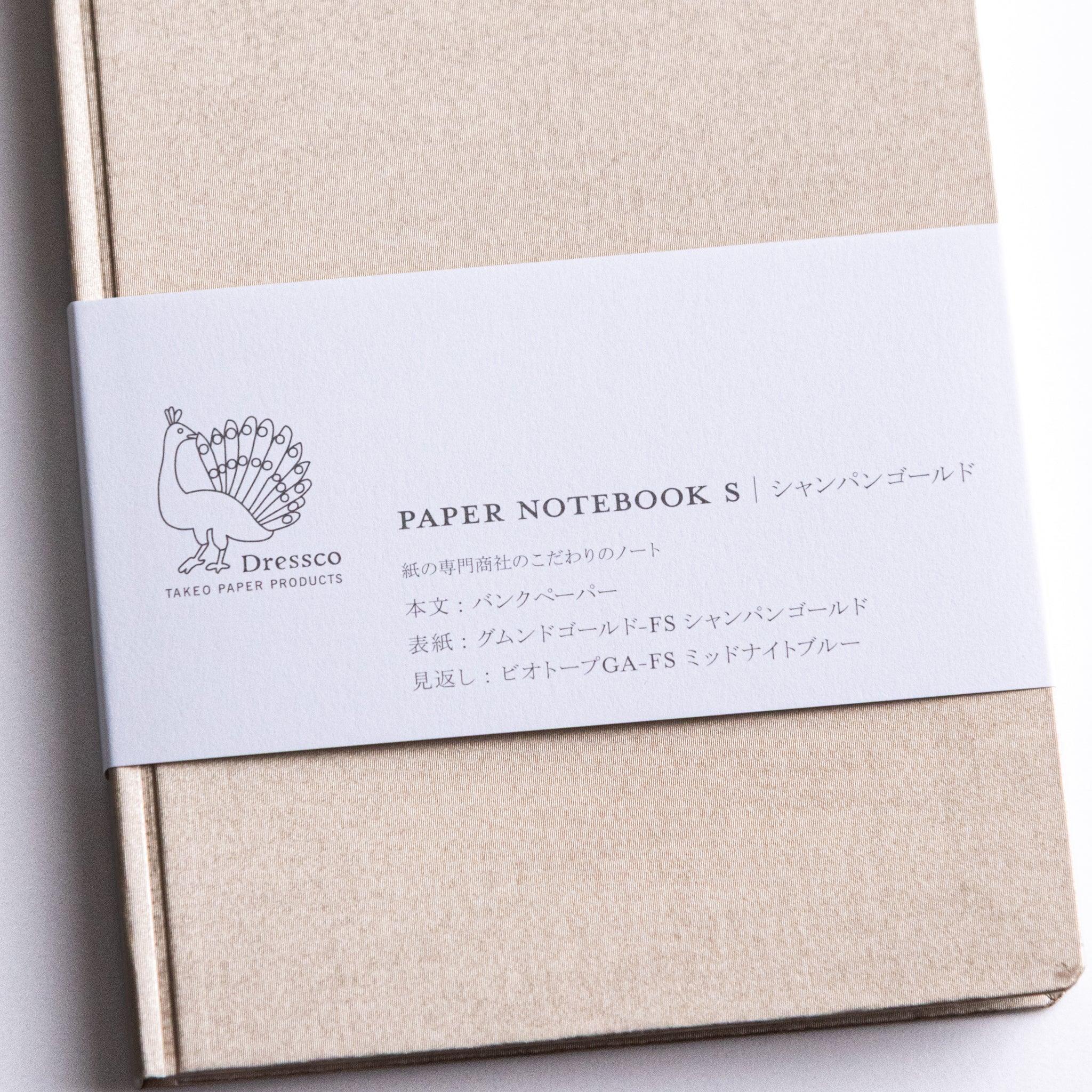 Close-up detail of Dressco Bank Ledger Paper A6 notebook showing the cover surface texture and paper material quality
