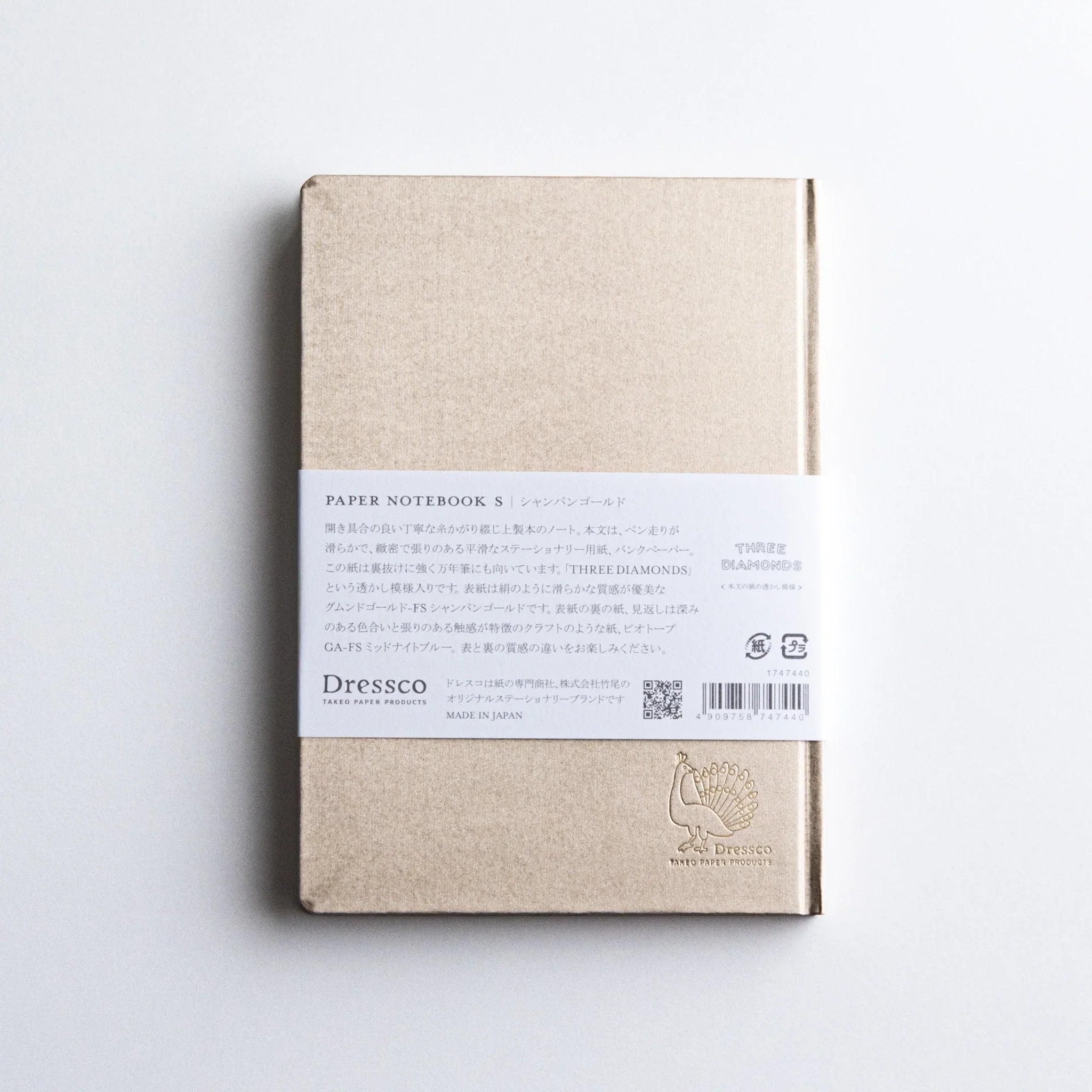 Side profile of Dressco Bank Ledger Paper A6 notebook showing the book thickness and visible page count from the side