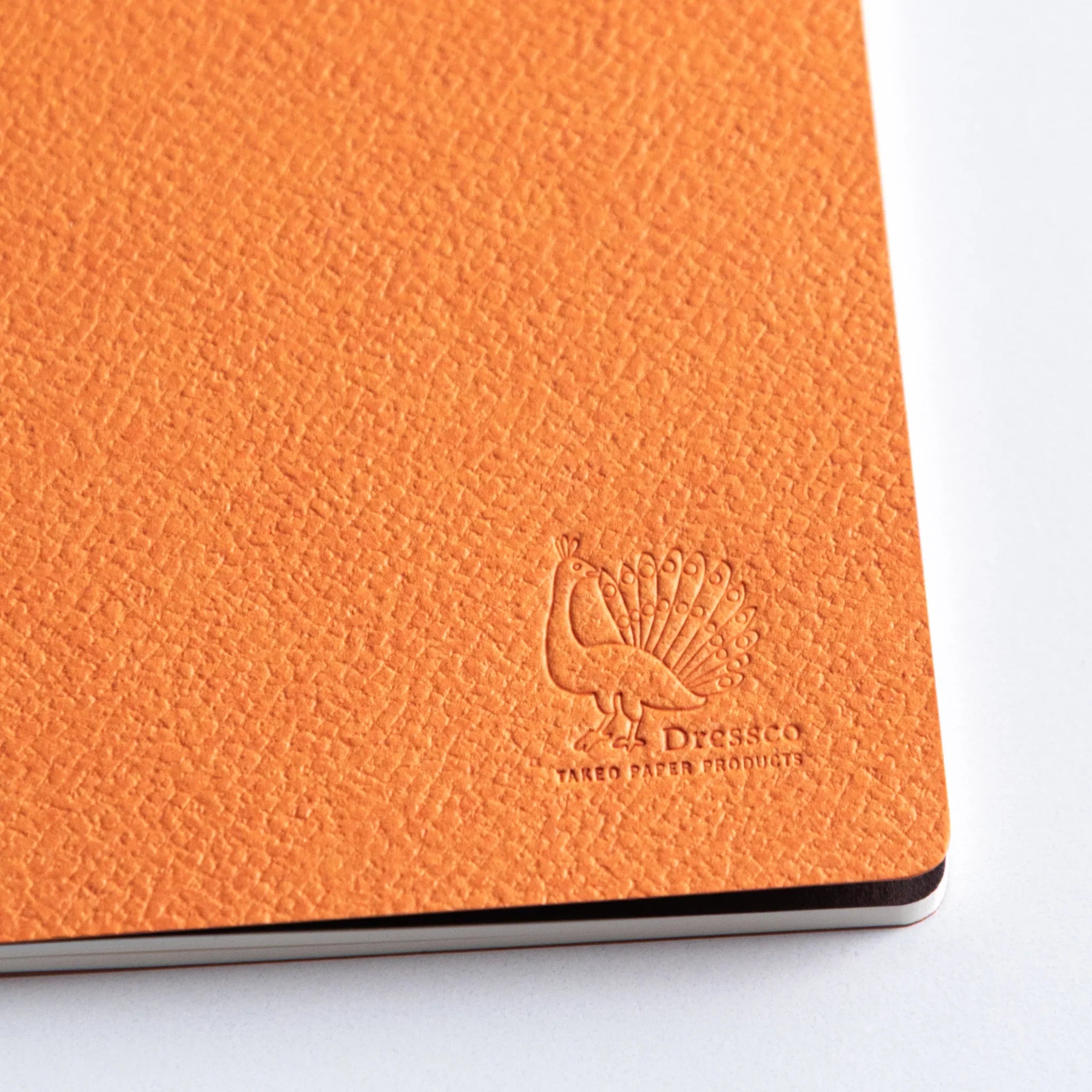 Close-up detail of bank ledger horizontal lines precisely printed on interior pages of Dressco A6 notebook throughout
