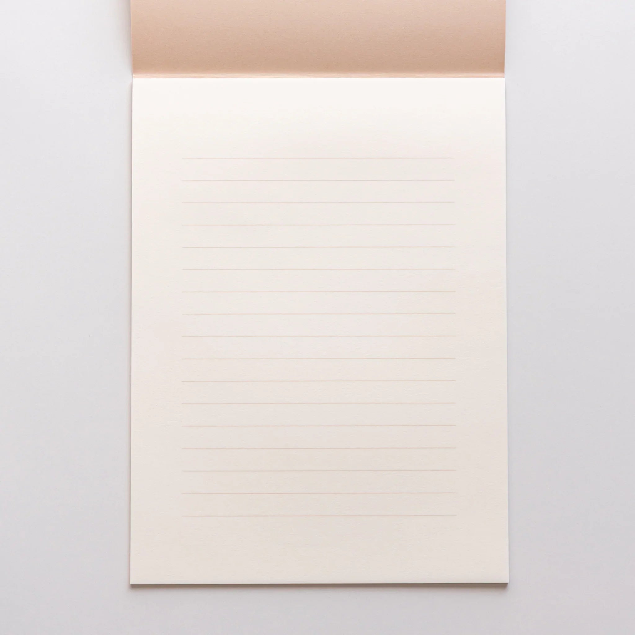 Dressco bank ledger paper A6 notebook, angled three-quarter view showing texture and cover design, Japanese Dressco