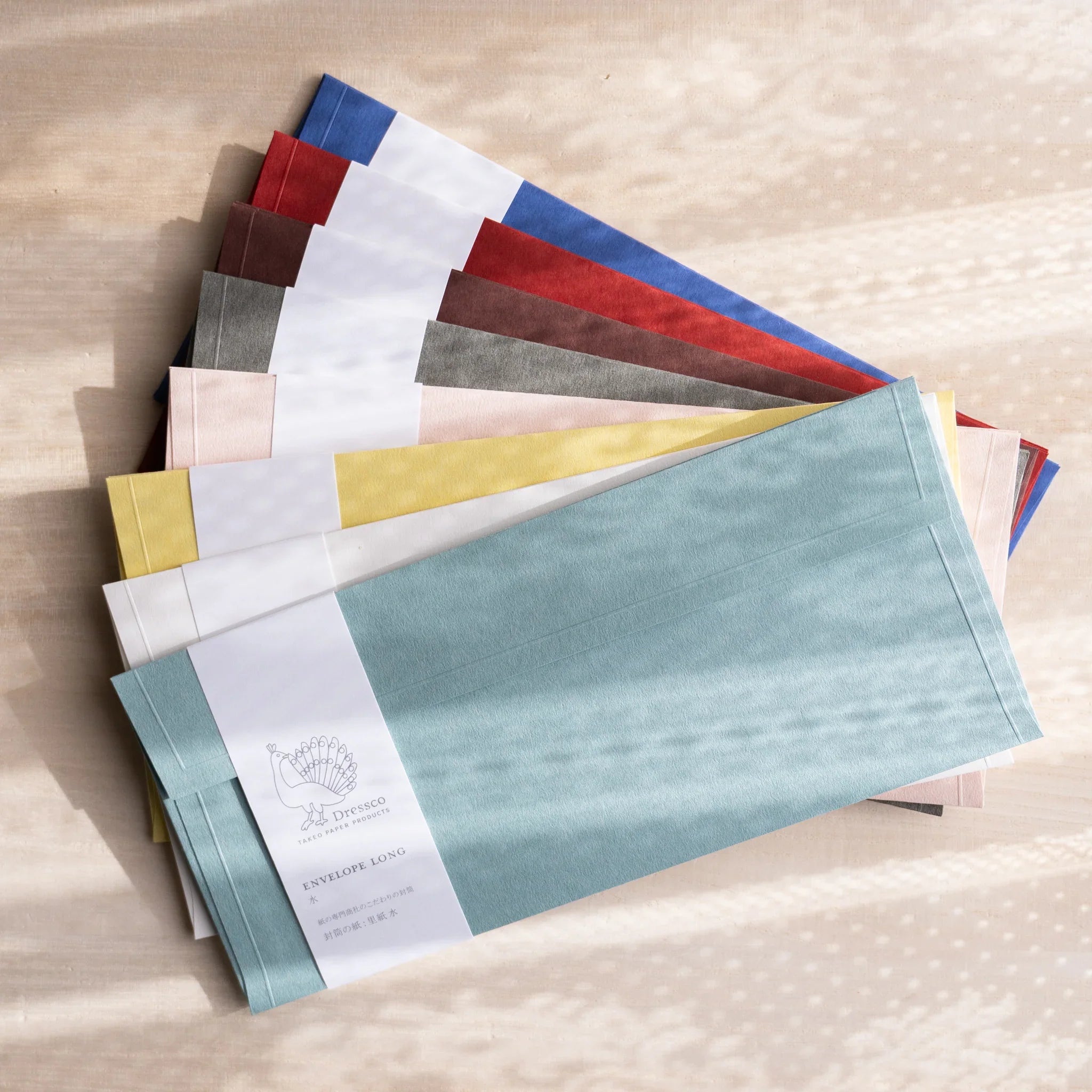 Dressco ivory medium embossed envelope image one, front view showing sealed flap, with raised embossing, set of three