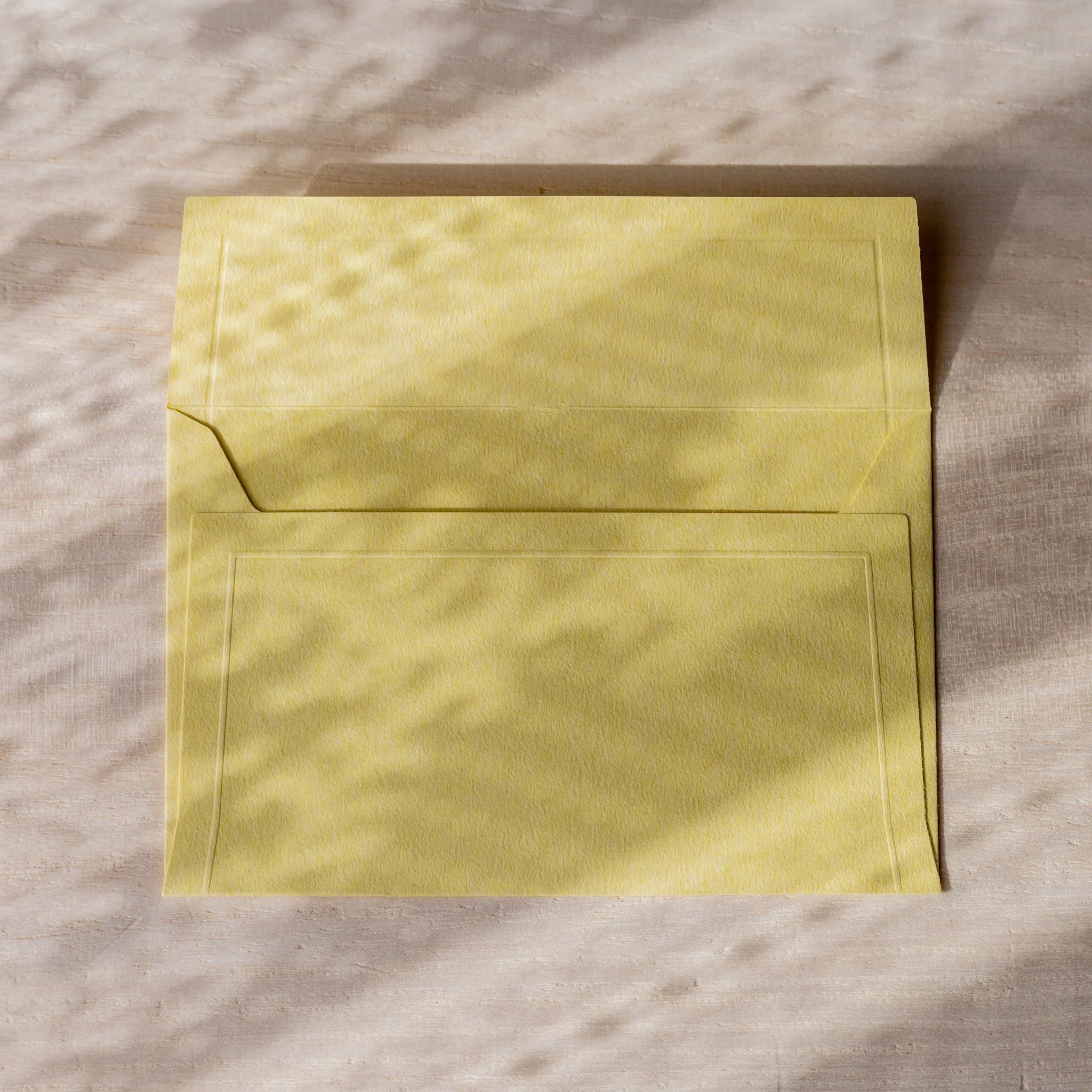 Dressco embossed small envelope in yellow, close-up detail quality finish