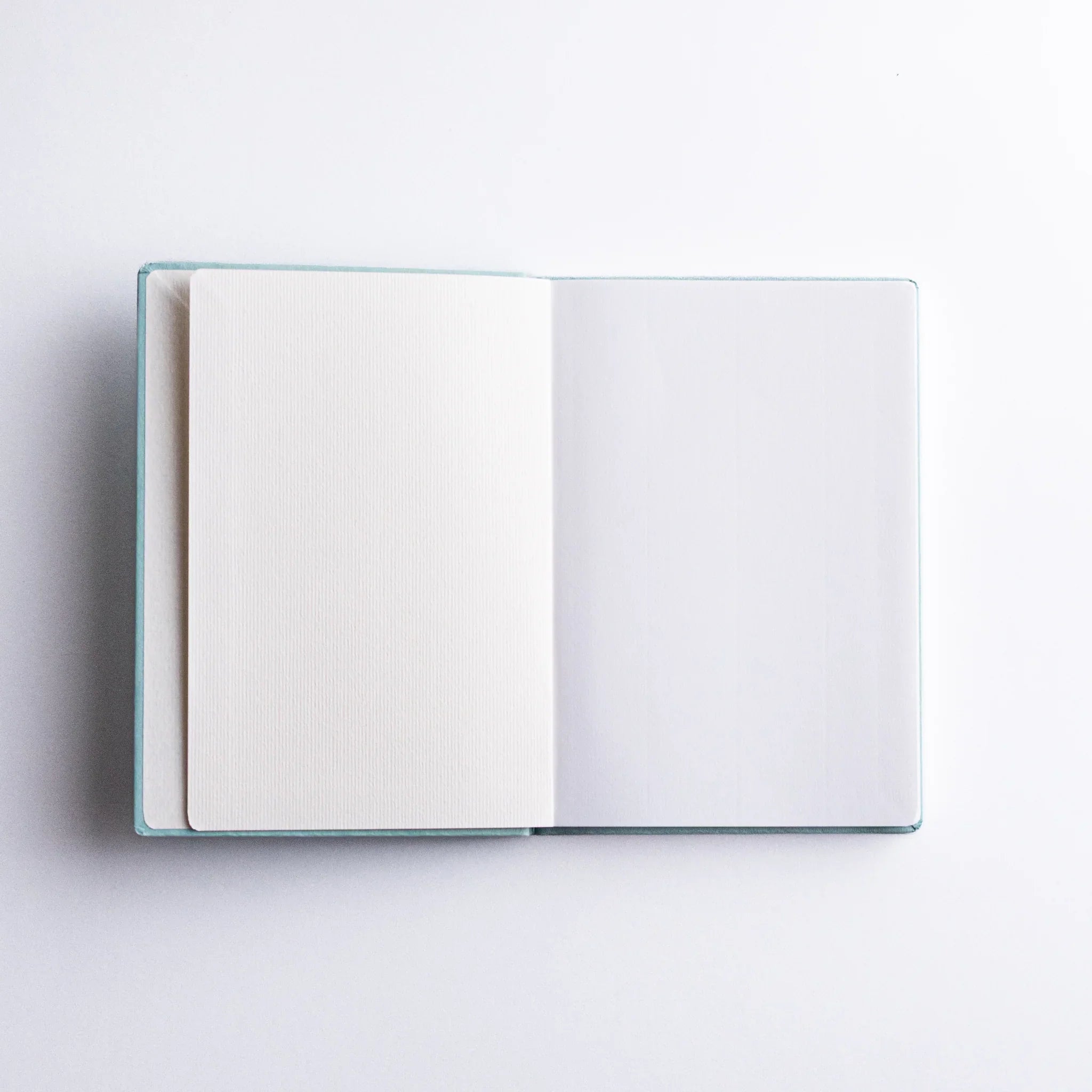 Front cover of Dressco Spica Laid Bond Paper A6 notebook showing the full cover design and A6 notebook dimensions