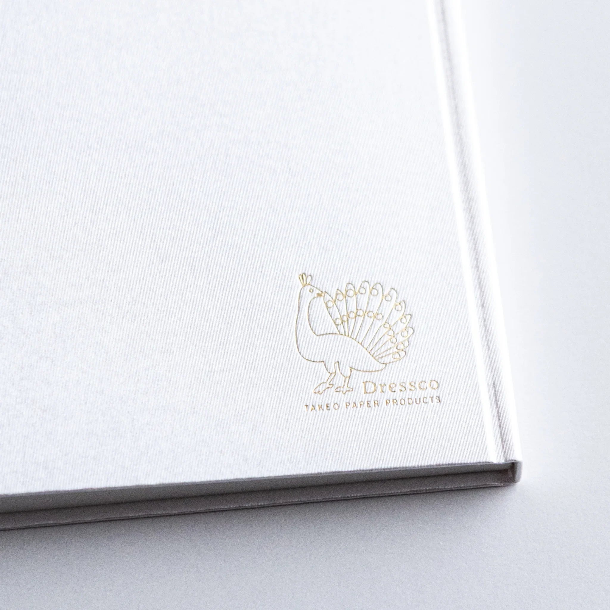 Close view of Dressco Spica Laid Bond Paper A6 notebook surface showing the cover texture and laid paper quality