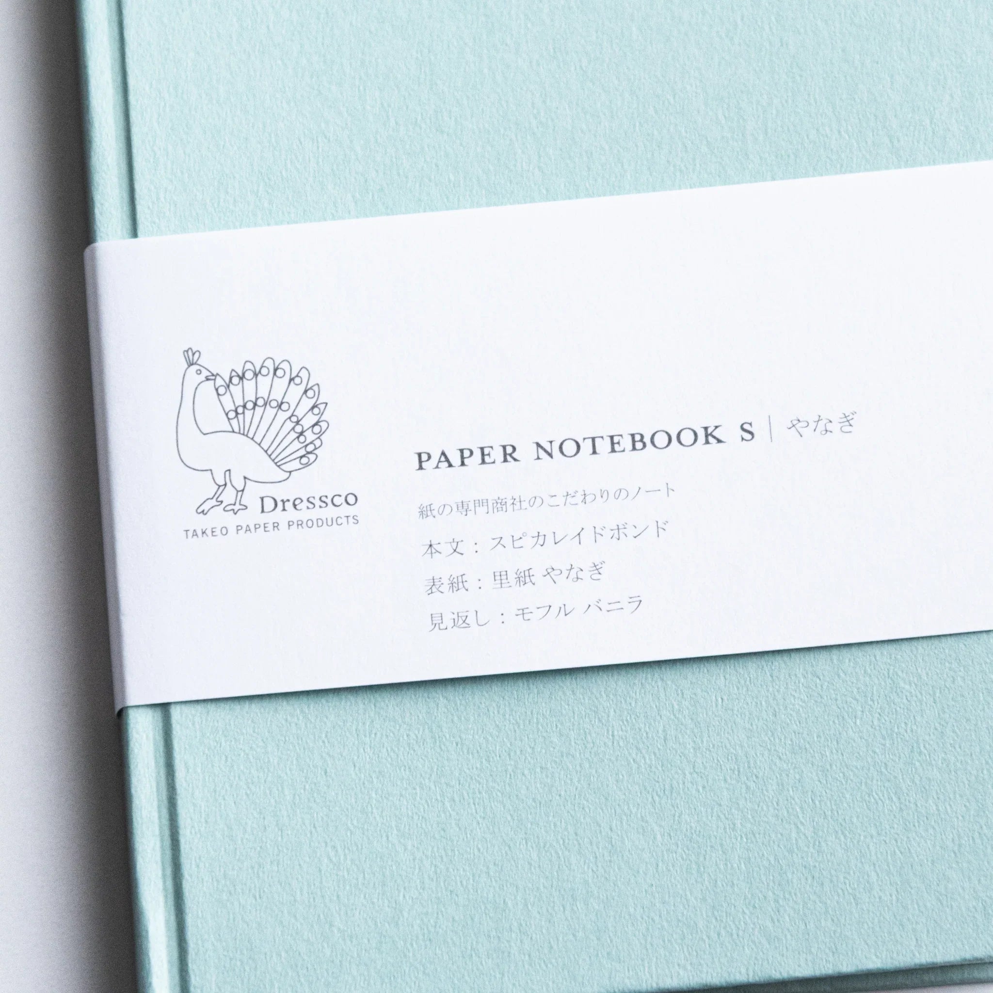 Dressco Spica Laid Bond Paper A6 notebook flat lay view showing full front cover and compact A6 format dimensions
