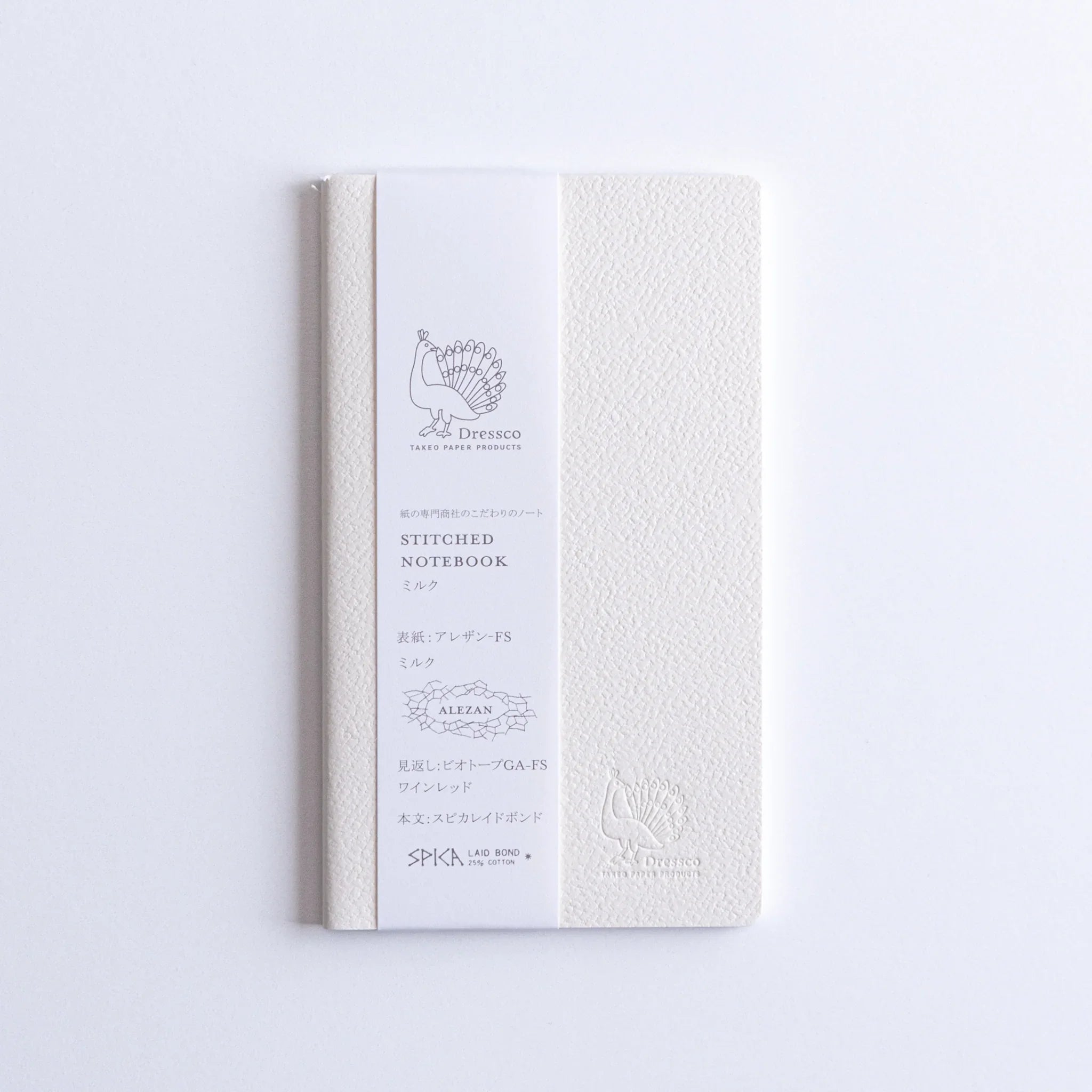 Top-down flat lay of Dressco Spica Laid Bond Stitched A6 notebook showing the full cover and A6 page format