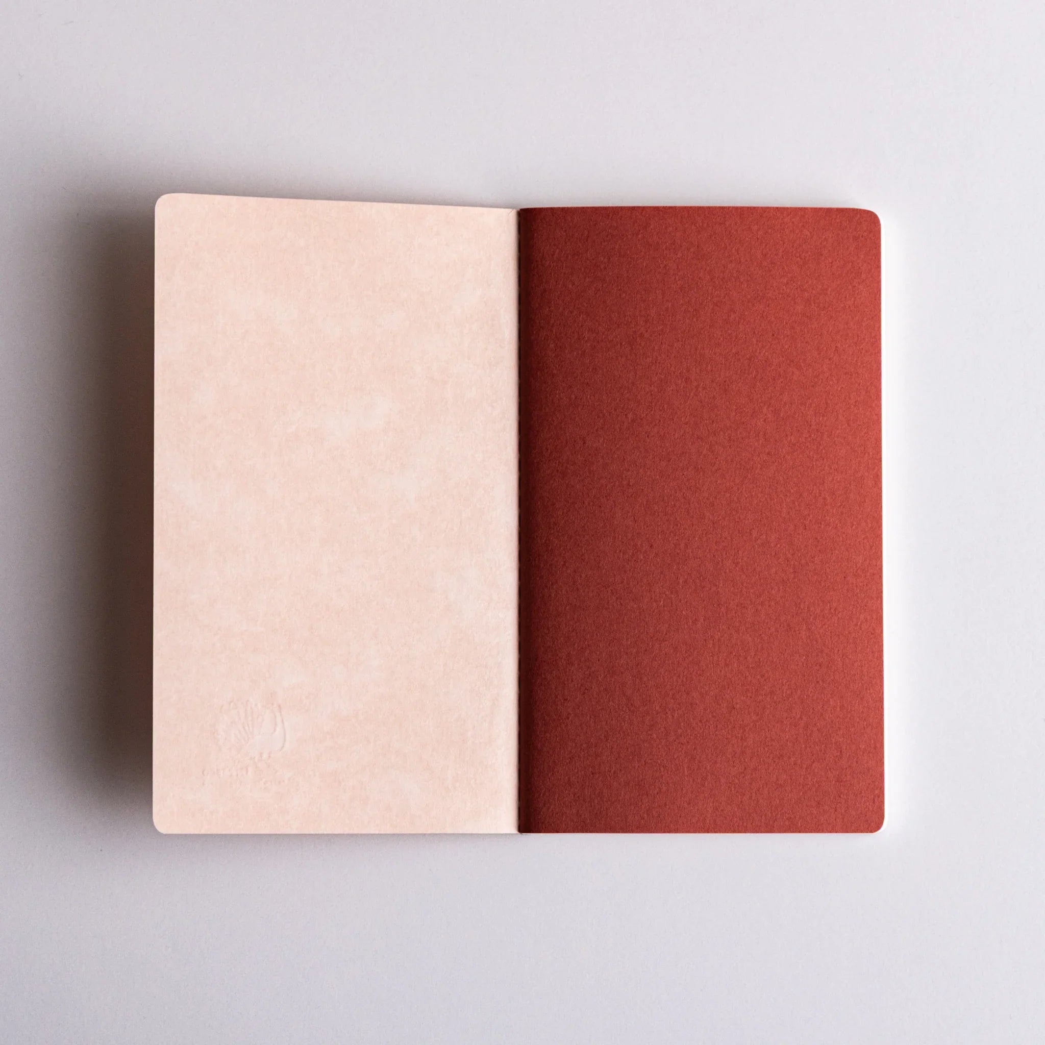 Lifestyle view of Dressco notebook in organized creative workspace setting for writing and personal correspondence use