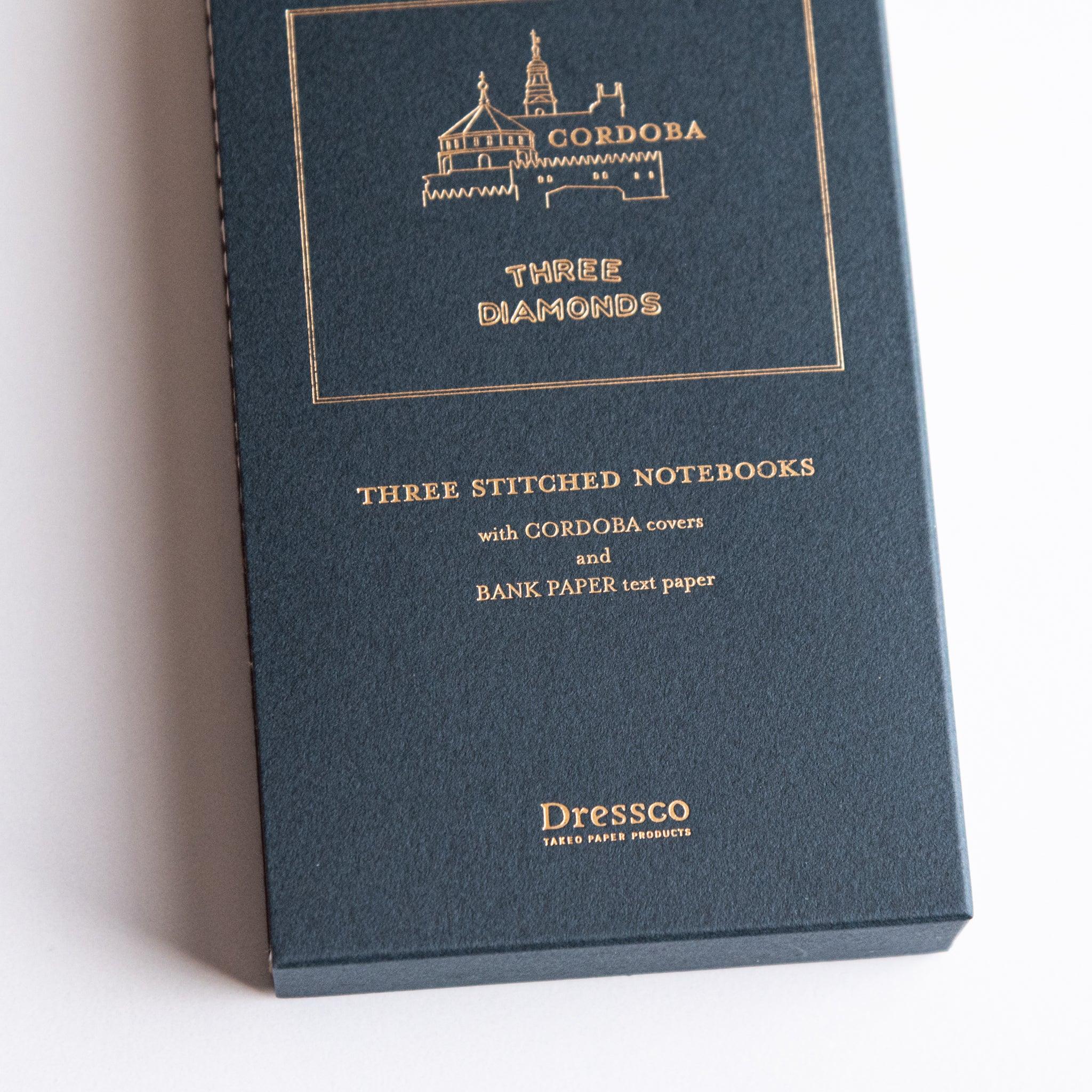 Open Dressco notebook displaying interior pages with ledger lines or grid pattern for writing and personal correspondence use