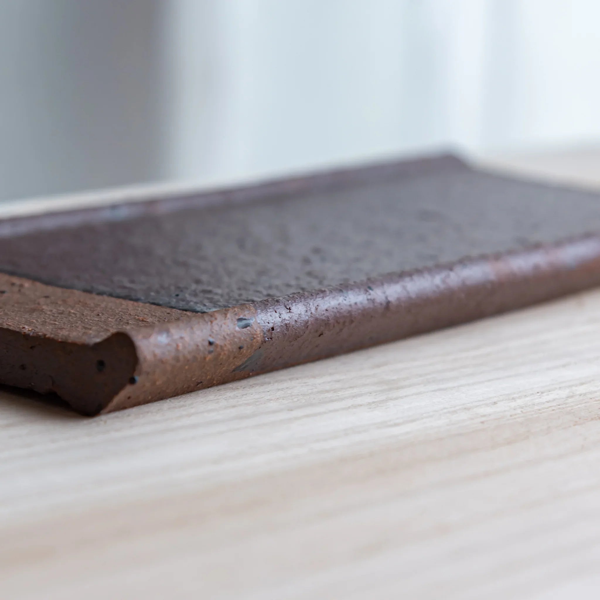 Echizen Kawara red tile ceramic pen tray with four slots shown in composition detail displayed in detail