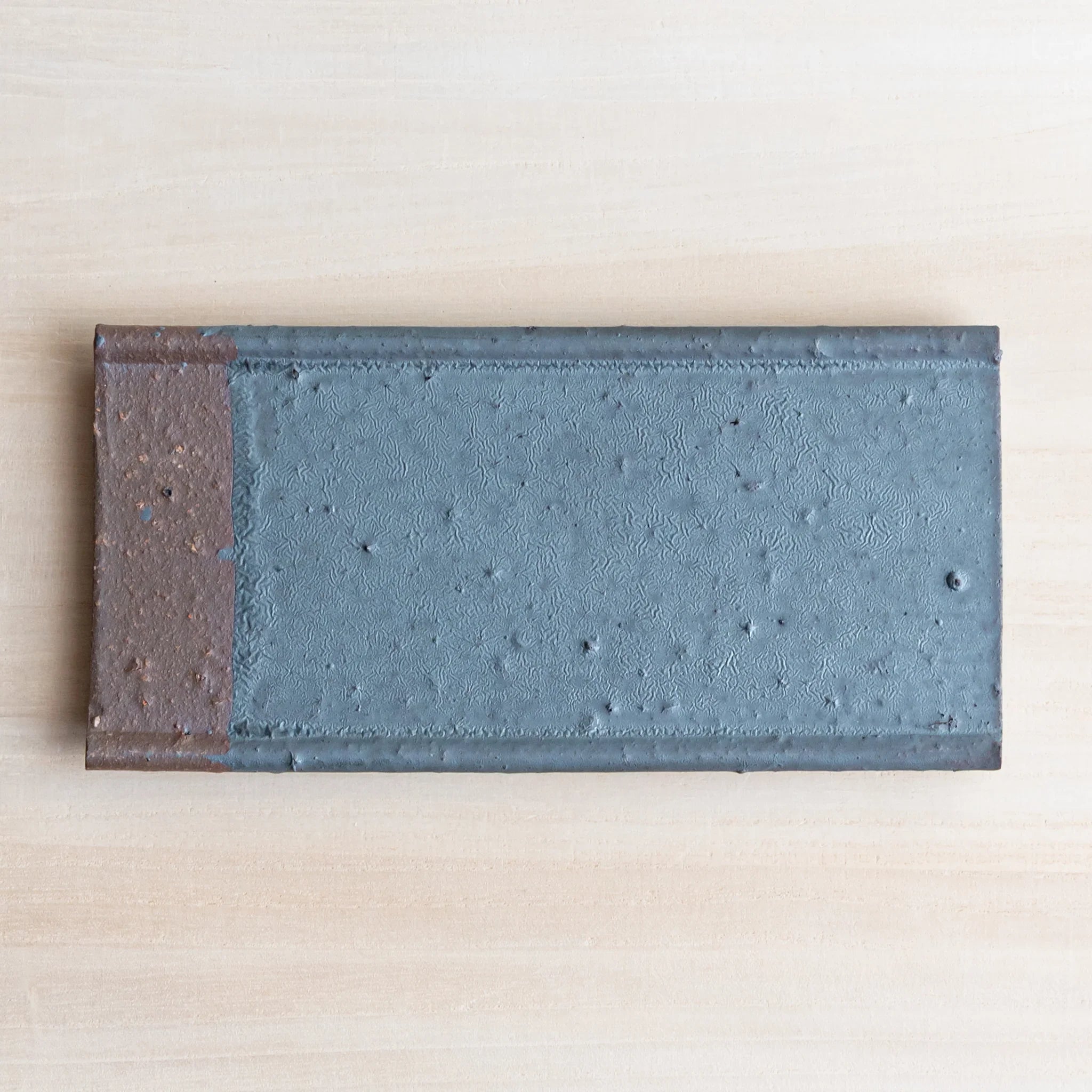 Echizen Kawara silver gray ceramic pen tray with four slots shown in composition in composition view