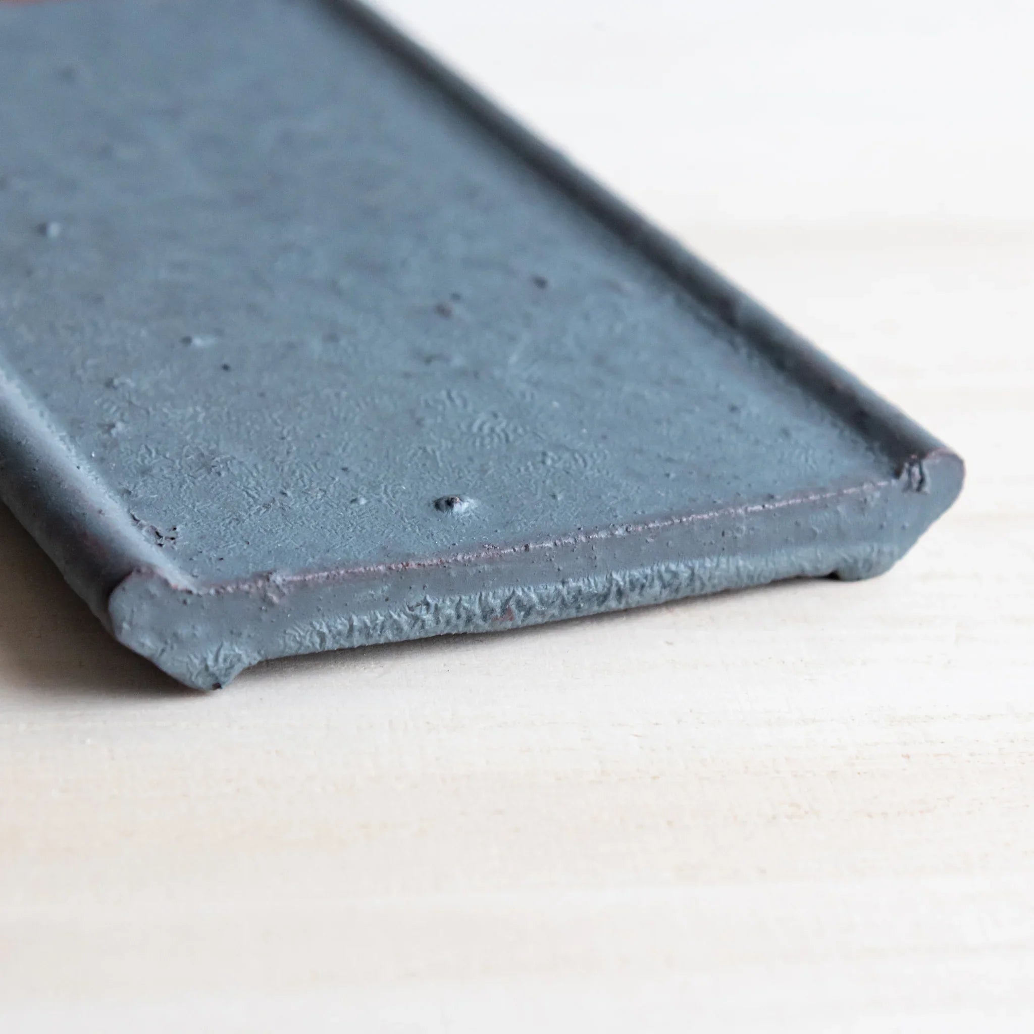 Echizen Kawara silver gray ceramic pen tray with four slots shown in composition in detail view composition