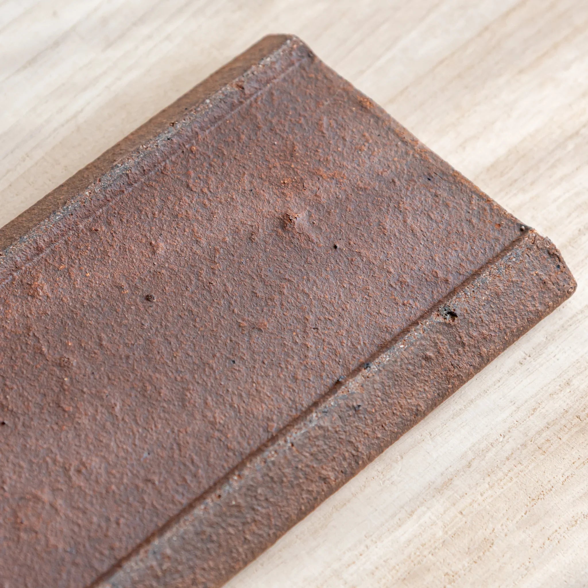 Echizen Kawara yakishime clay ceramic pen tray with four slots shown in composition detail in composition detail