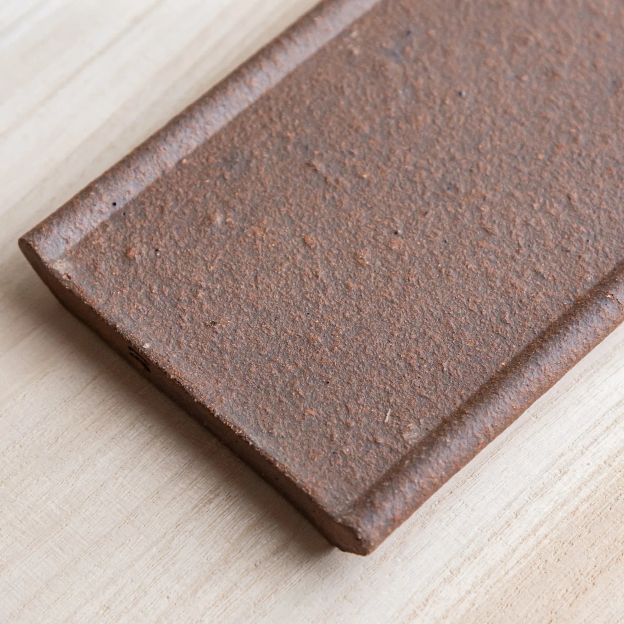 Echizen Kawara yakishime clay ceramic pen tray with four slots shown in composition detail displayed in detail