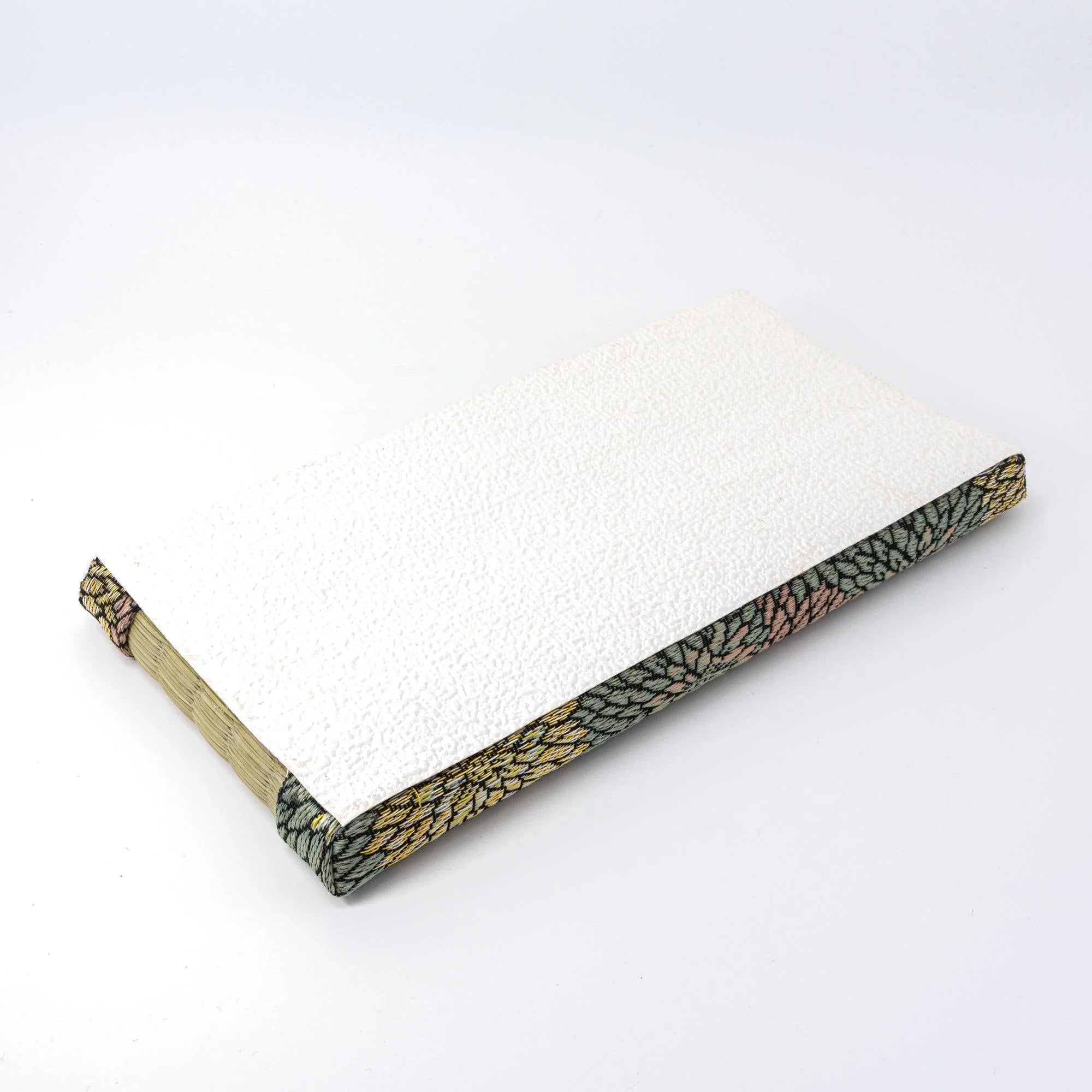 Chrysanthemum Tatami Pen Tray shown upside down revealing white textured washi-paper base with brocade border edges