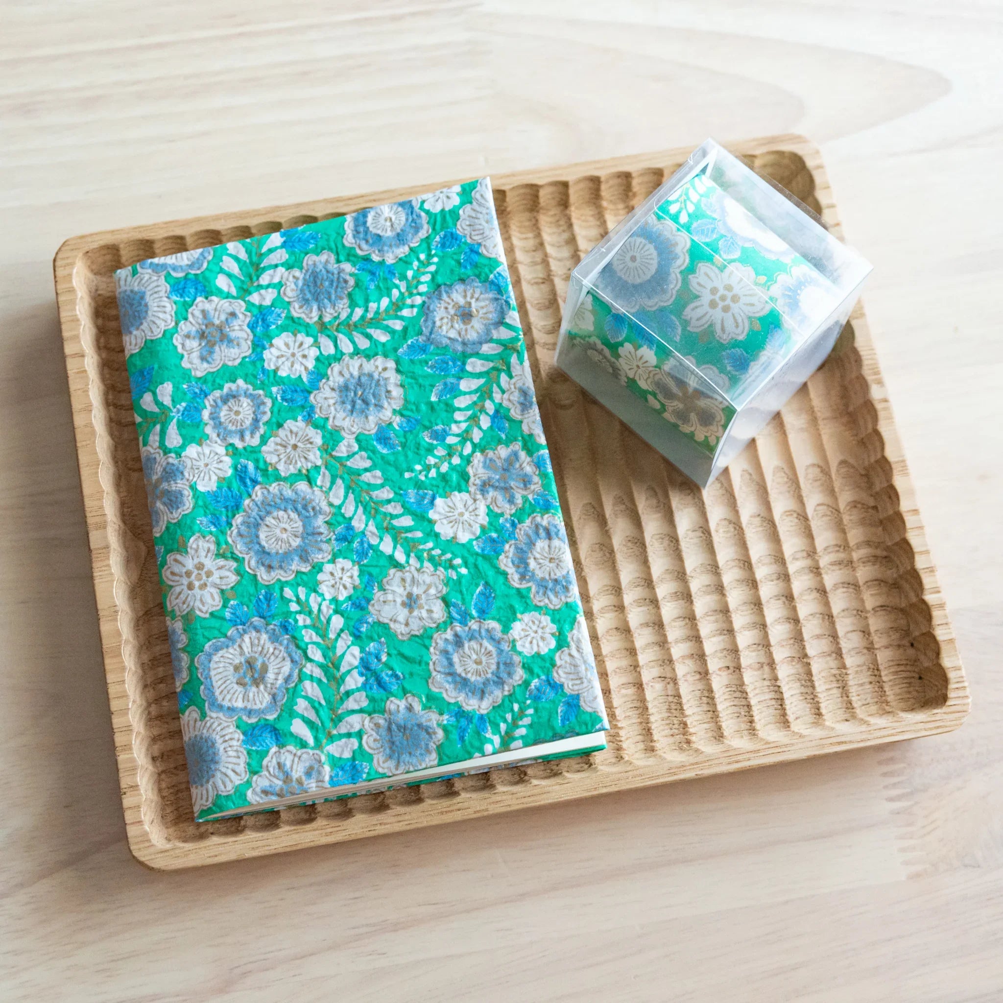 Emerald green hand-dyed yuzen washi book cover A6, showing vibrant turquoise yuzen surface with floral decoration