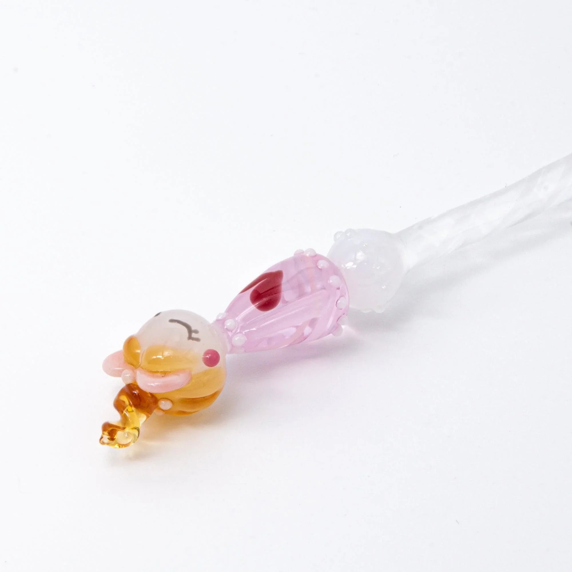 Lovery-Chan heart pattern glass dip pen close-up showing pink glass barrel and character nib head design