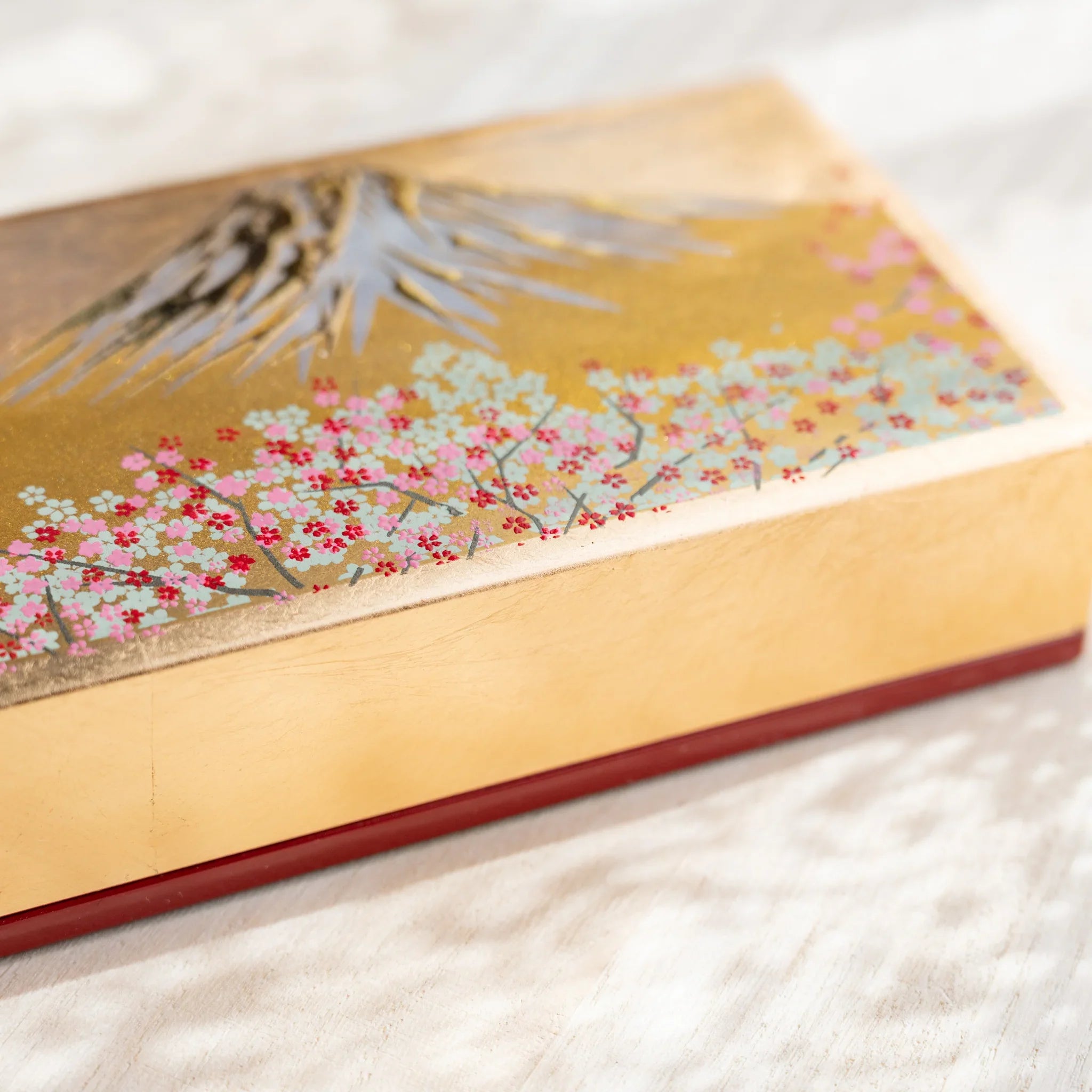 Yamanaka pen case displaying traditional Japanese landscape artwork and pattern design displayed clearly