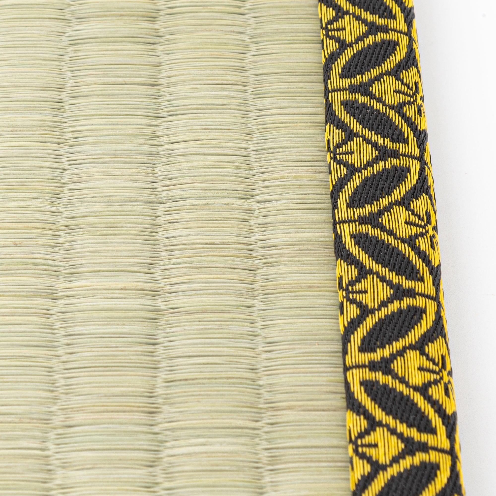Angled view showing tatami straw weave texture and gold diamond pattern brocade trim detail clearly visible