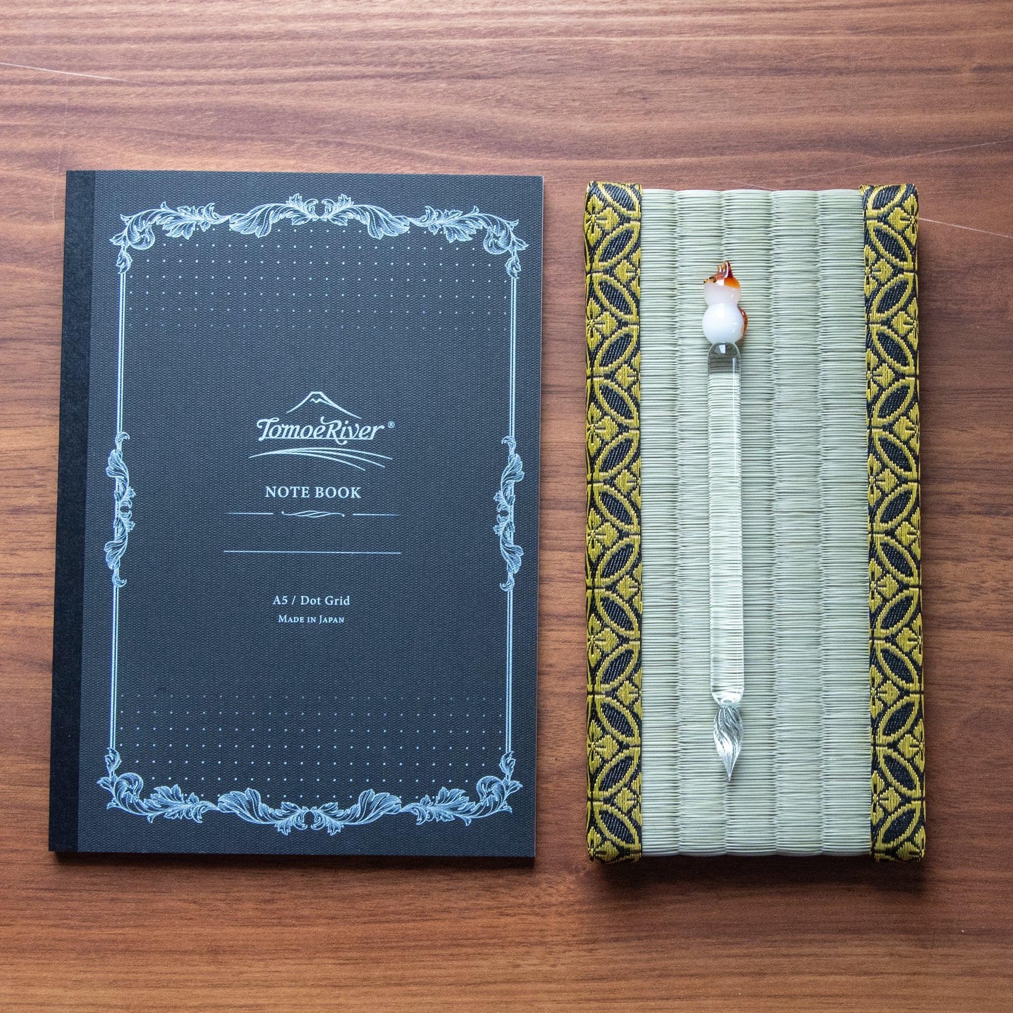 Straw weave pen tray with dual decorative gold shippo patterned side border trims clearly visible on display