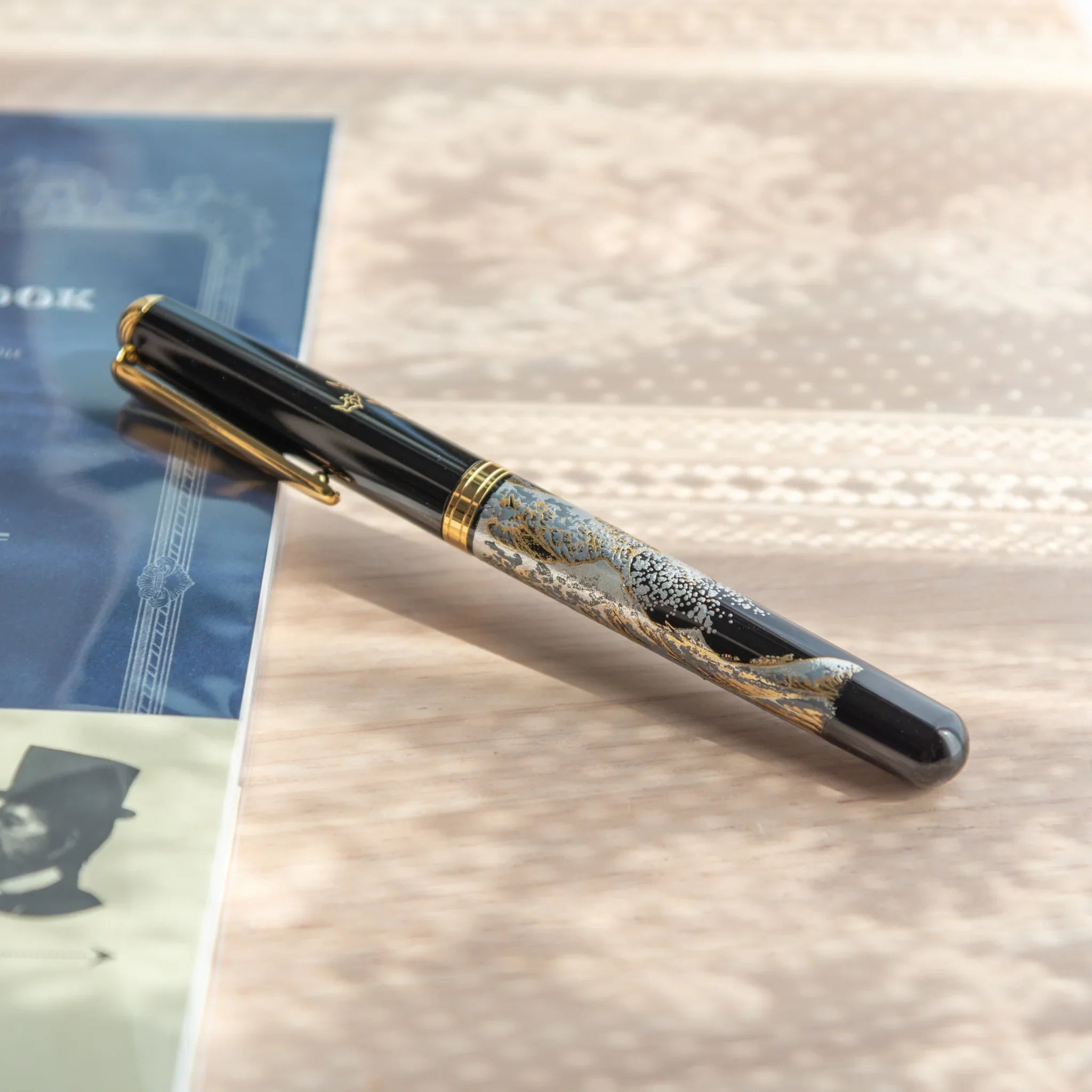 Great Wave Yamanaka fountain pen displays hand-painted lacquer dramatic seascape and mountain detail