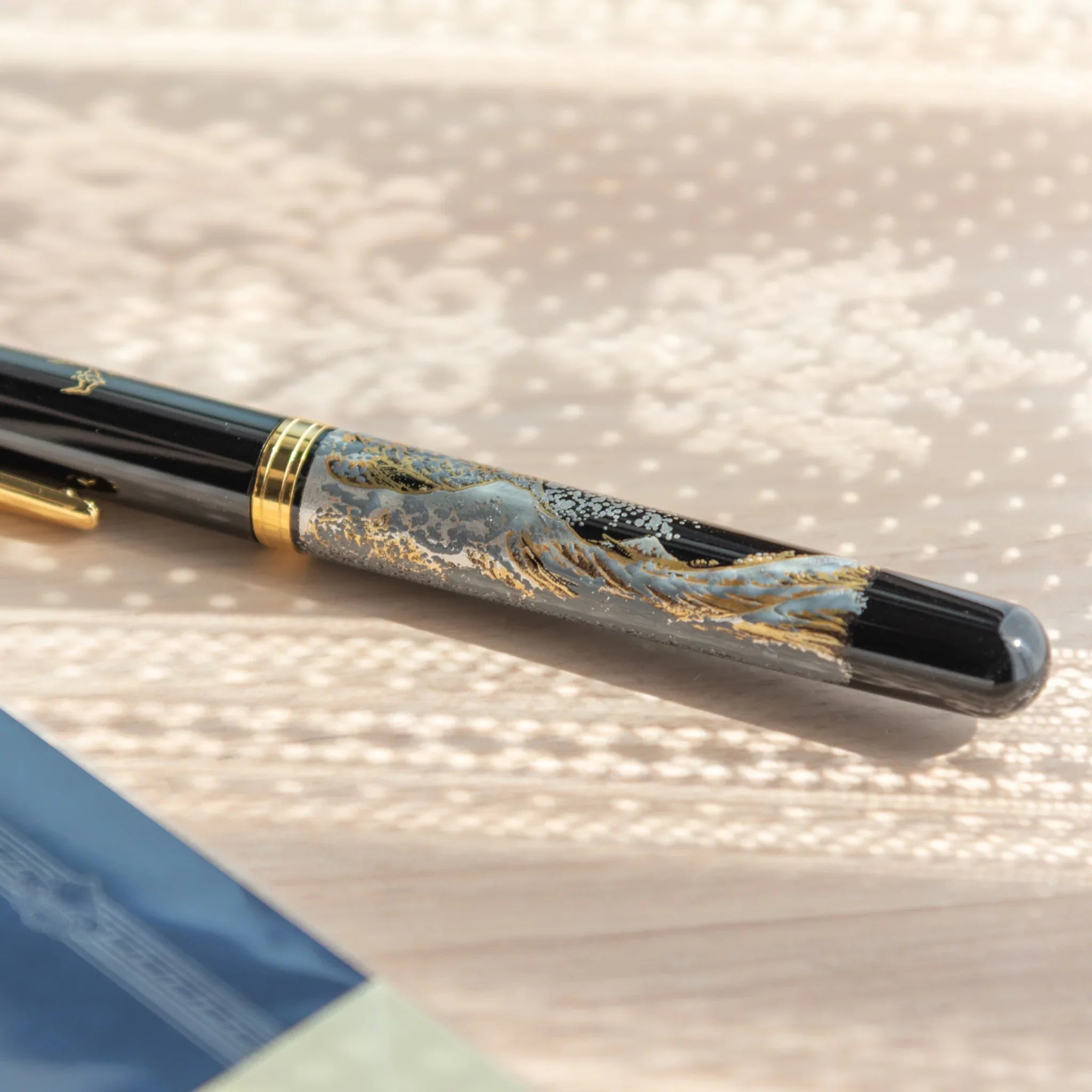 Japanese Yamanaka lacquer fountain pen features Great Wave ocean and Mount Fuji landscape composition