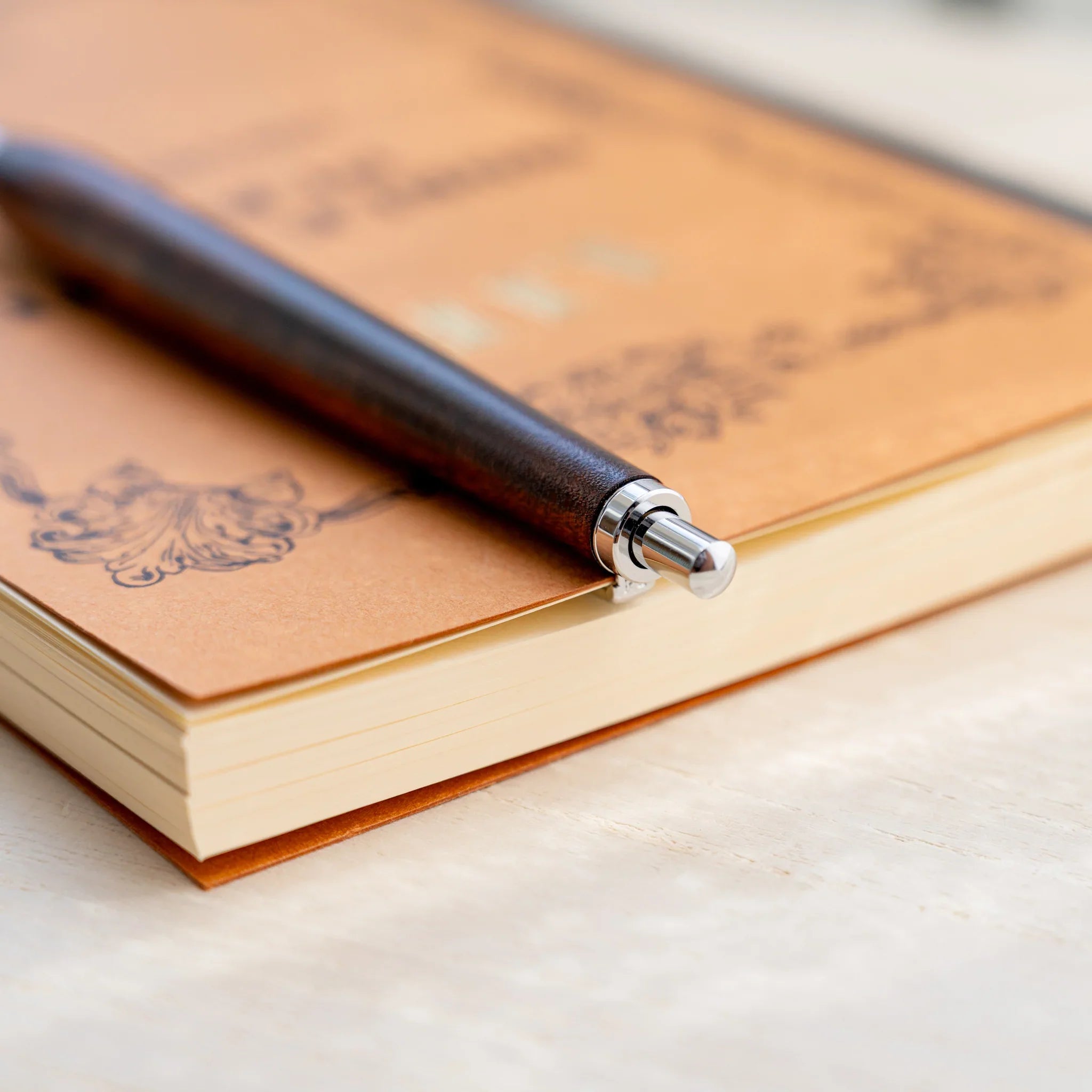 Horse chestnut wood urushi lacquered ballpoint pen in amber-brown, Japanese wood, silver knock, clip and tip