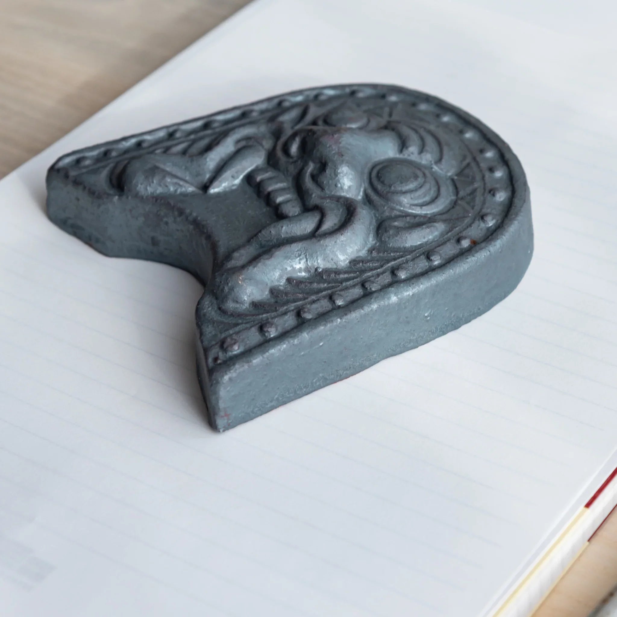 Japanese Kawara large roof guardian ceramic paperweight with steadfast expression shown in composition view