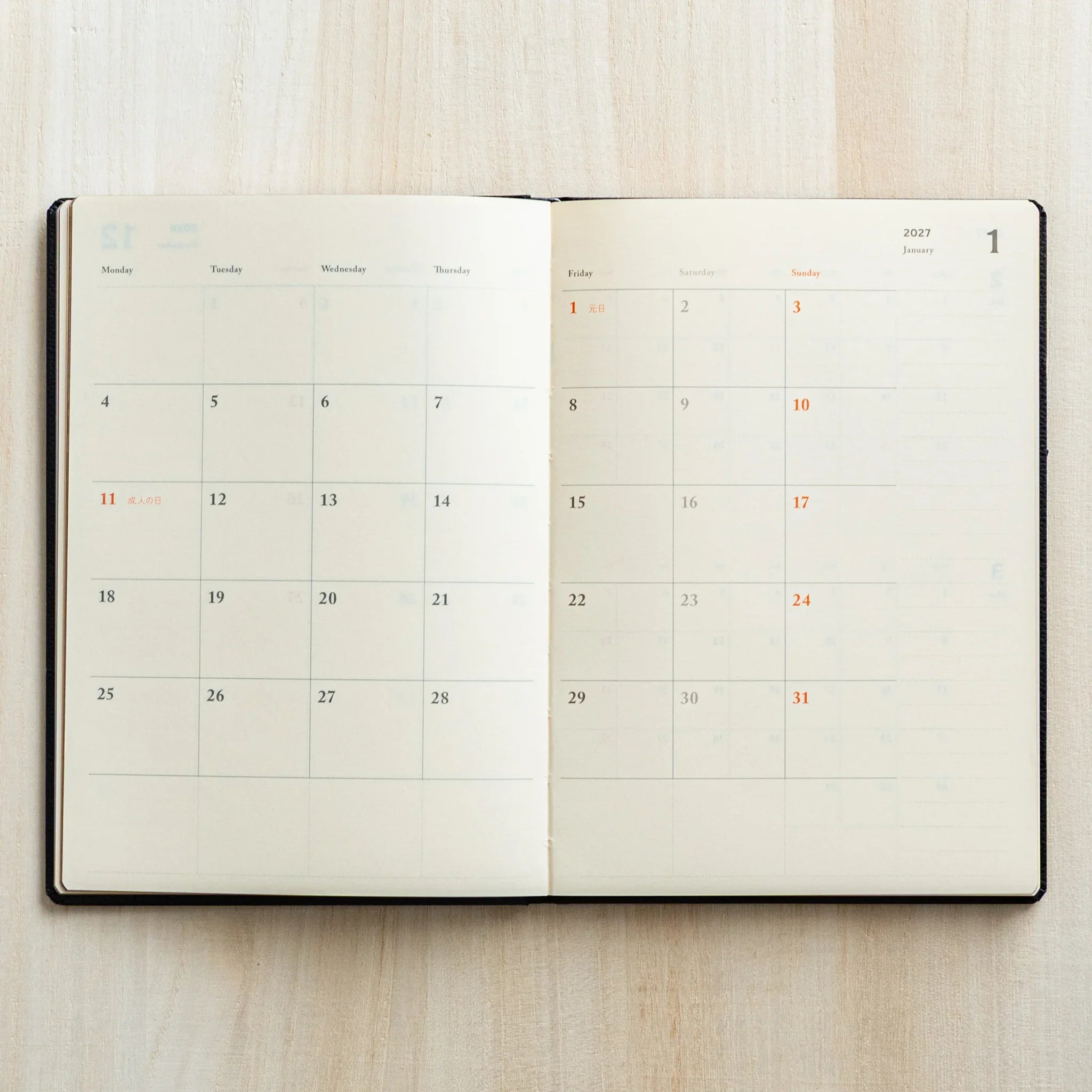 Life Noble 2026 planning notebook featuring dark tone, open showing pages showing gold lettering