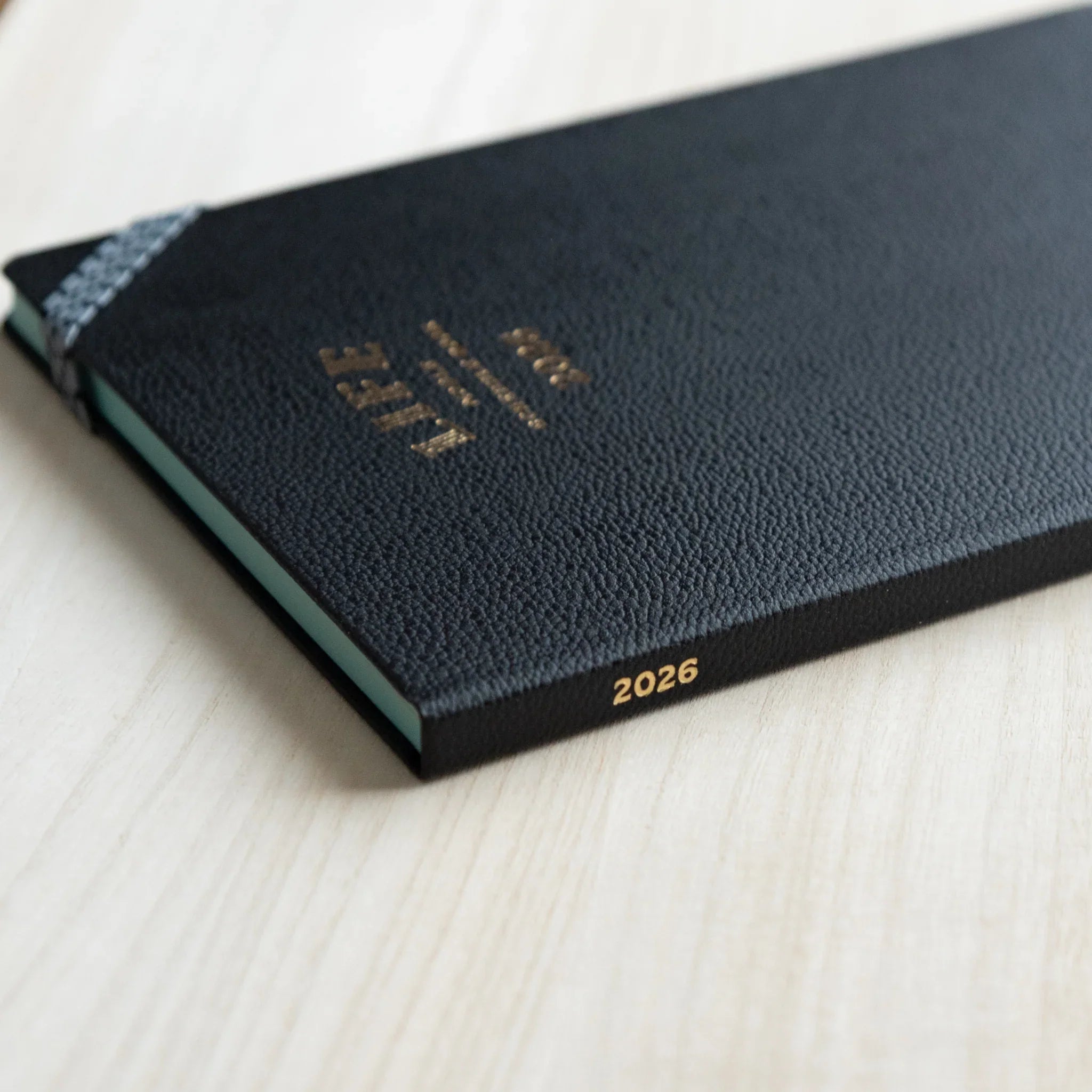 Life Noble 2026 schedule book in charcoal, product shot with embossed text