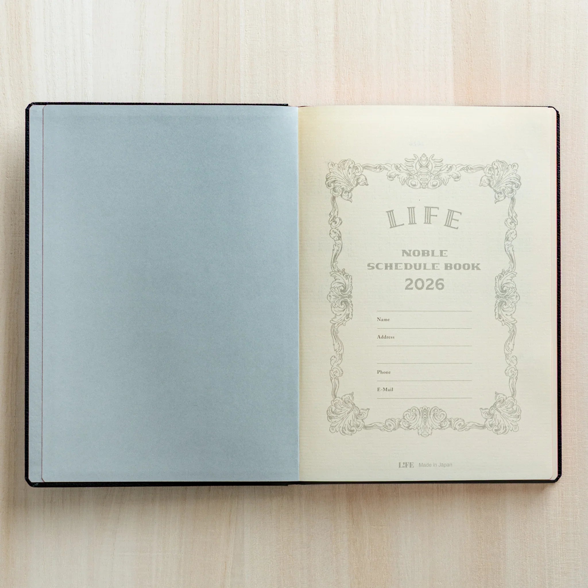 Life Noble planner for 2026 in dark navy, front cover view with gold foil embossing