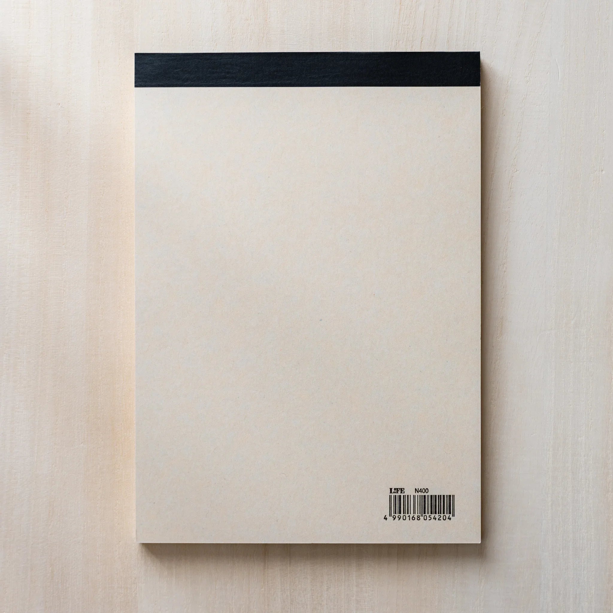 Life Noble A5 writing pad, arranged view stylized cover highlighting paper quality