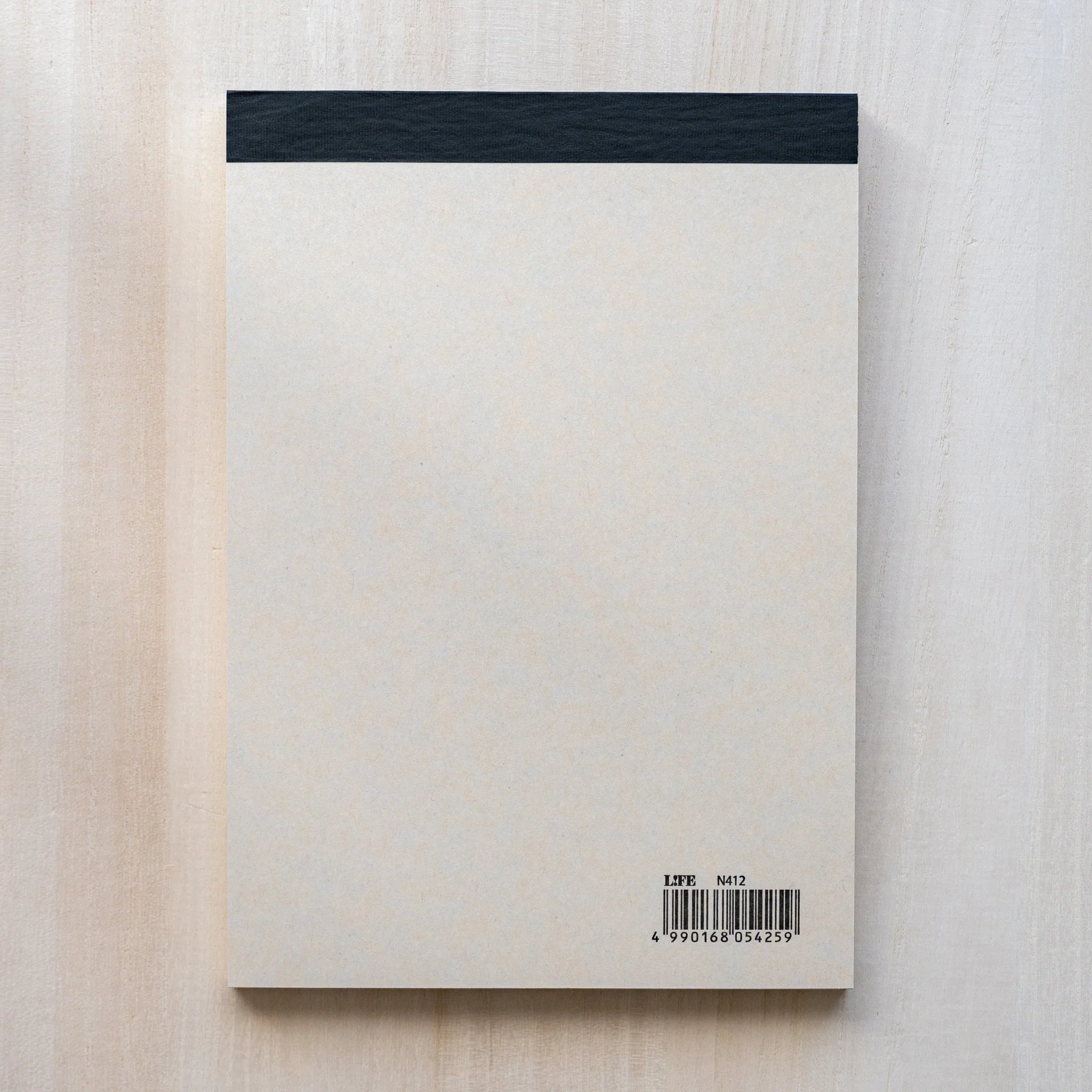 Life Noble B6 writing pad with decorative pattern, flat lay displaying demonstrating binding detail