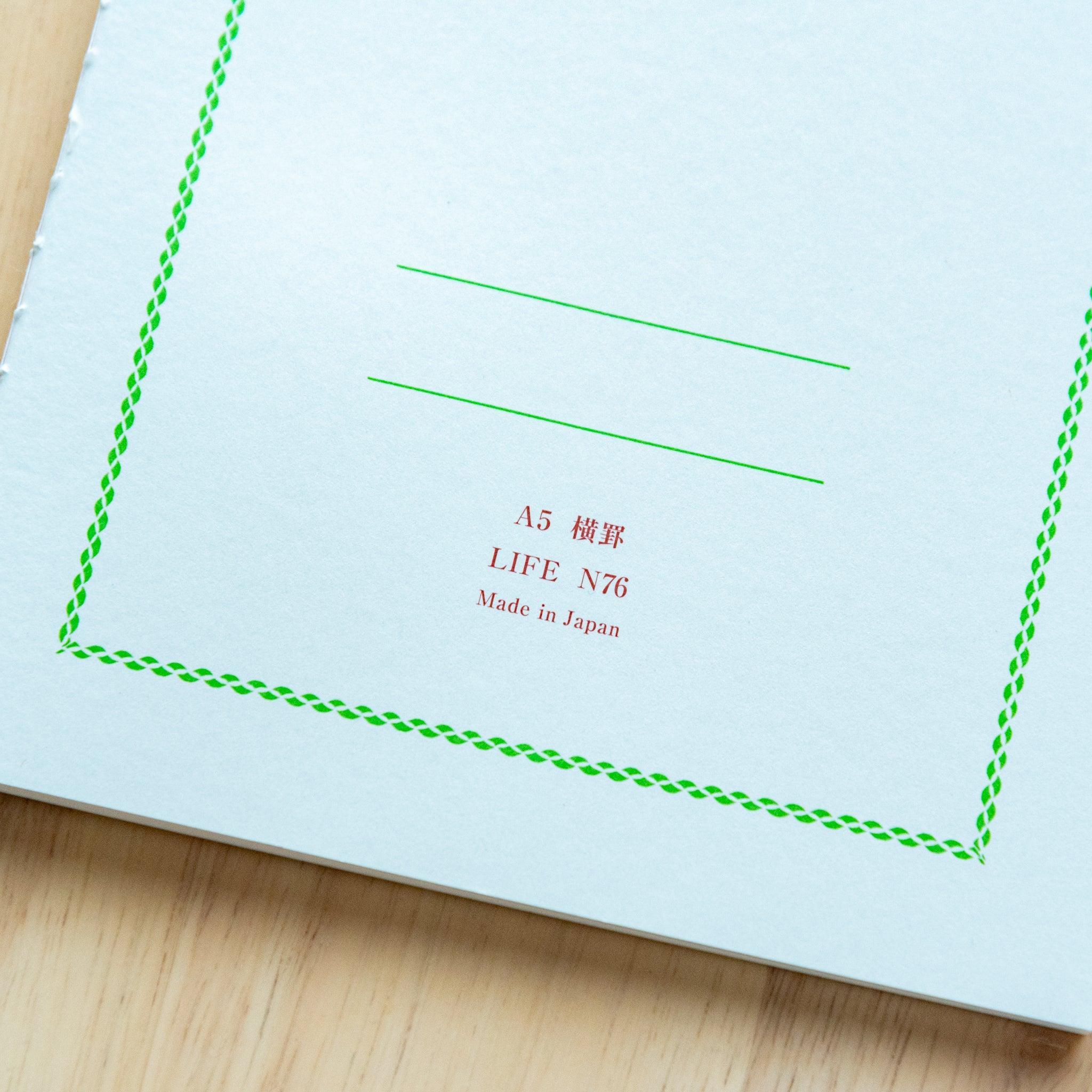 LIFE Pistachio A5 notebook, pages spread showing binding flexibility and quality with green cover design