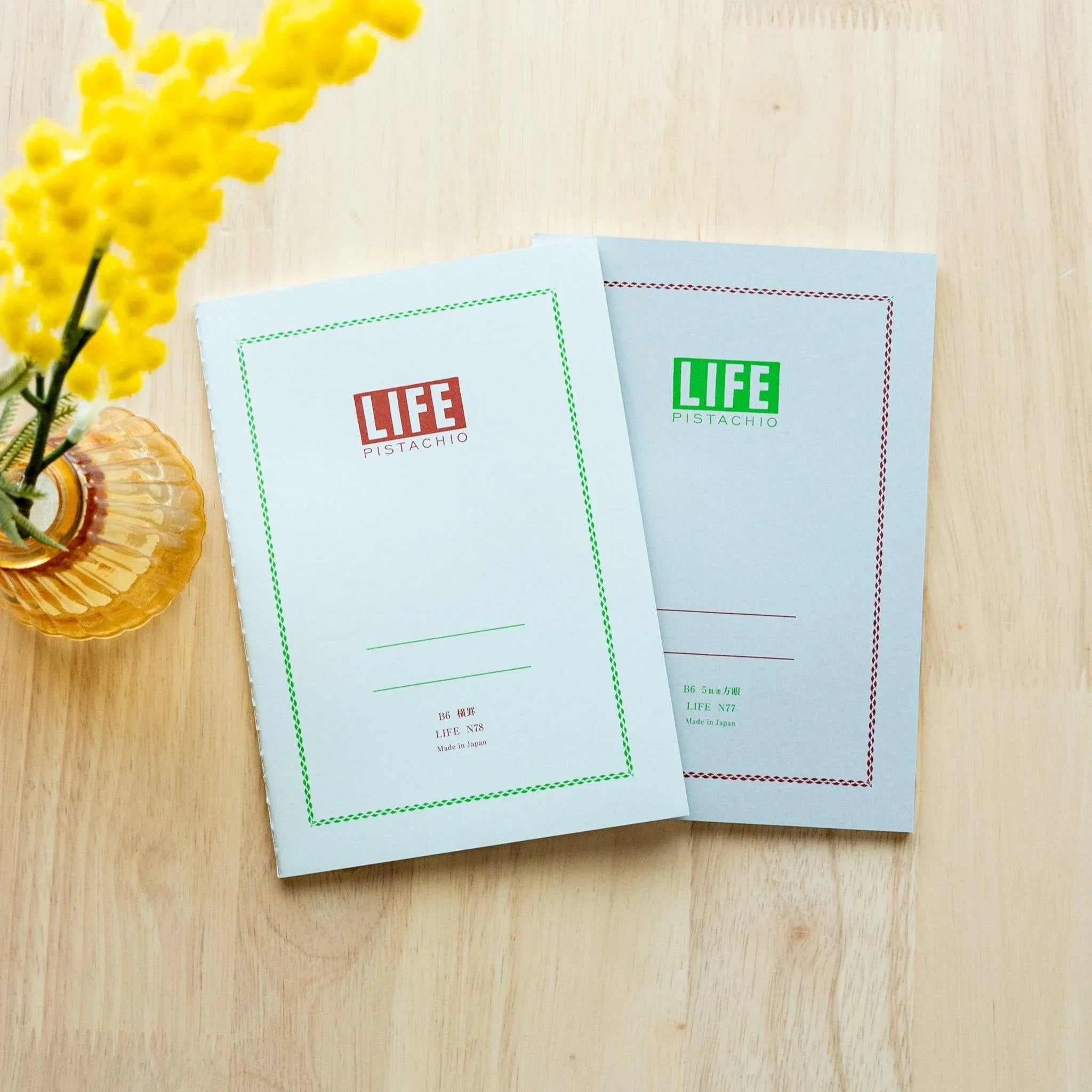 LIFE Pistachio journal with soft green, angled side view of slim binding profile emphasizing quality design