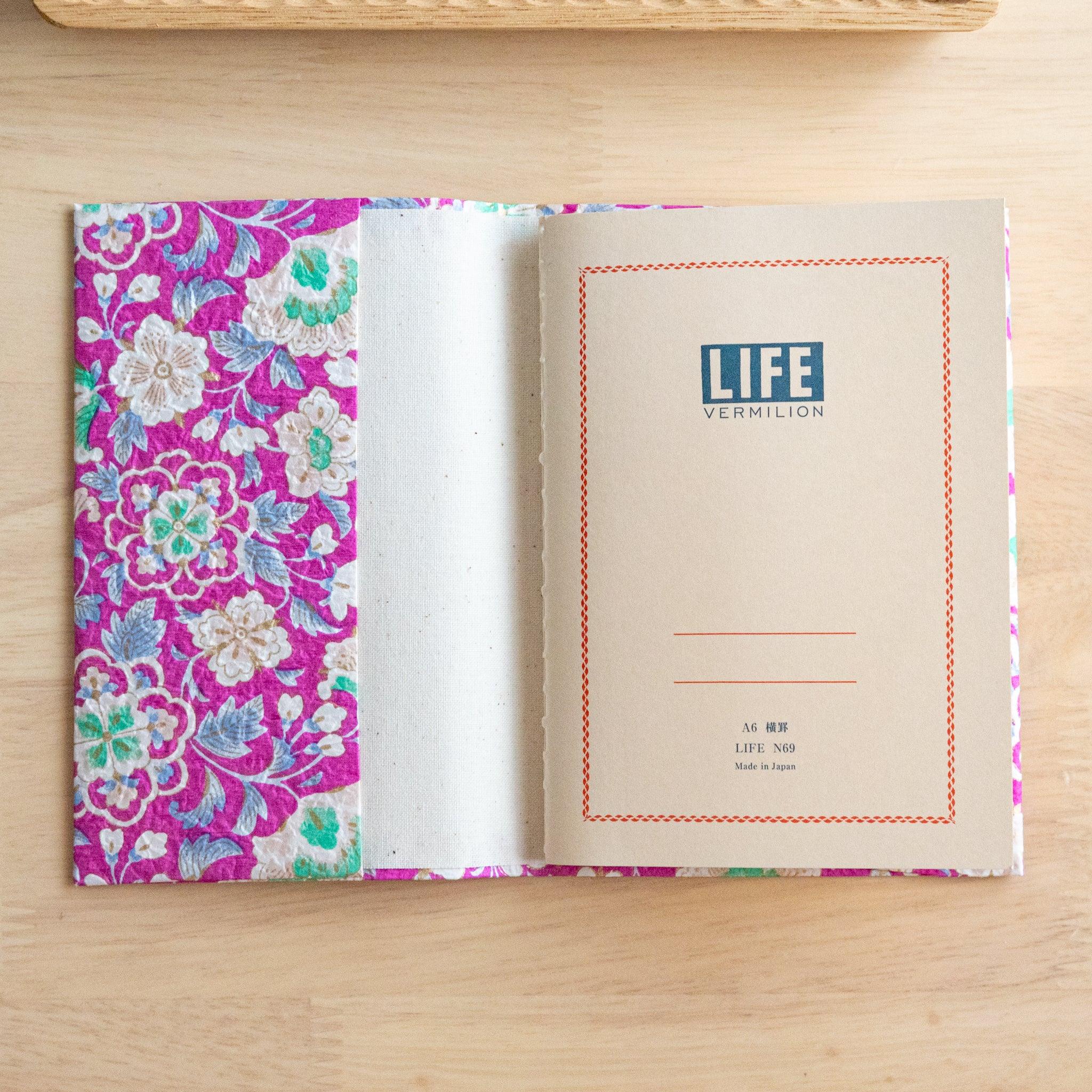 Magenta garden hand-dyed yuzen washi book cover A6, overhead view highlighting elaborate yuzen dyed surface design