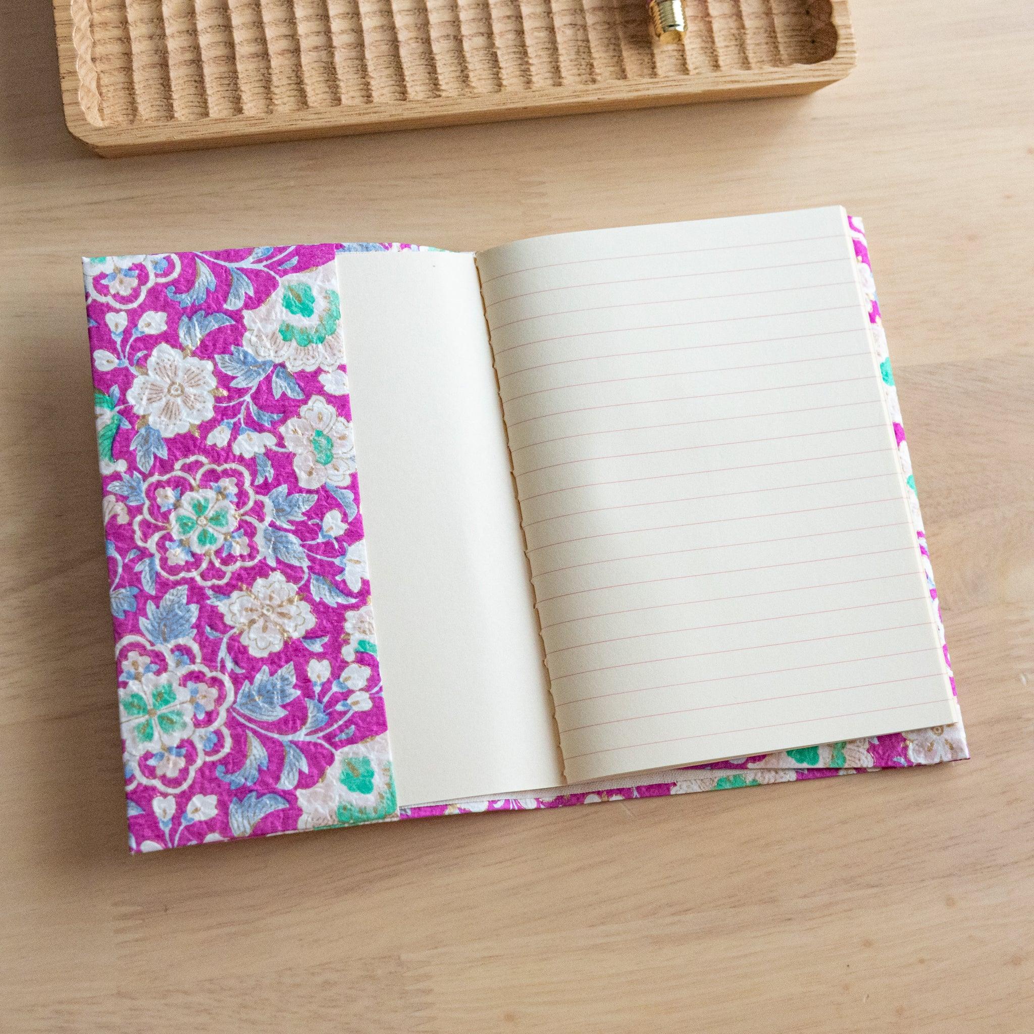 Magenta Garden yuzen washi book cover angled view with deep magenta and delicate gold accents, hand-dyed Japanese paper