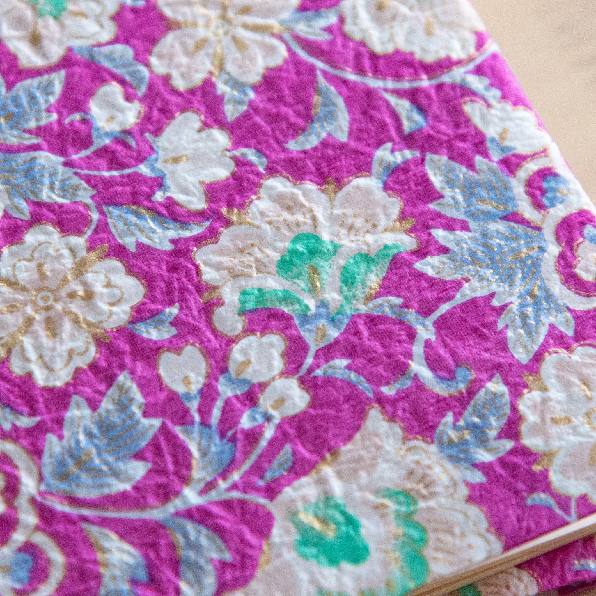 Magenta Garden hand-dyed washi book cover spine view displaying yuzen textile pattern, traditional Japanese stationery