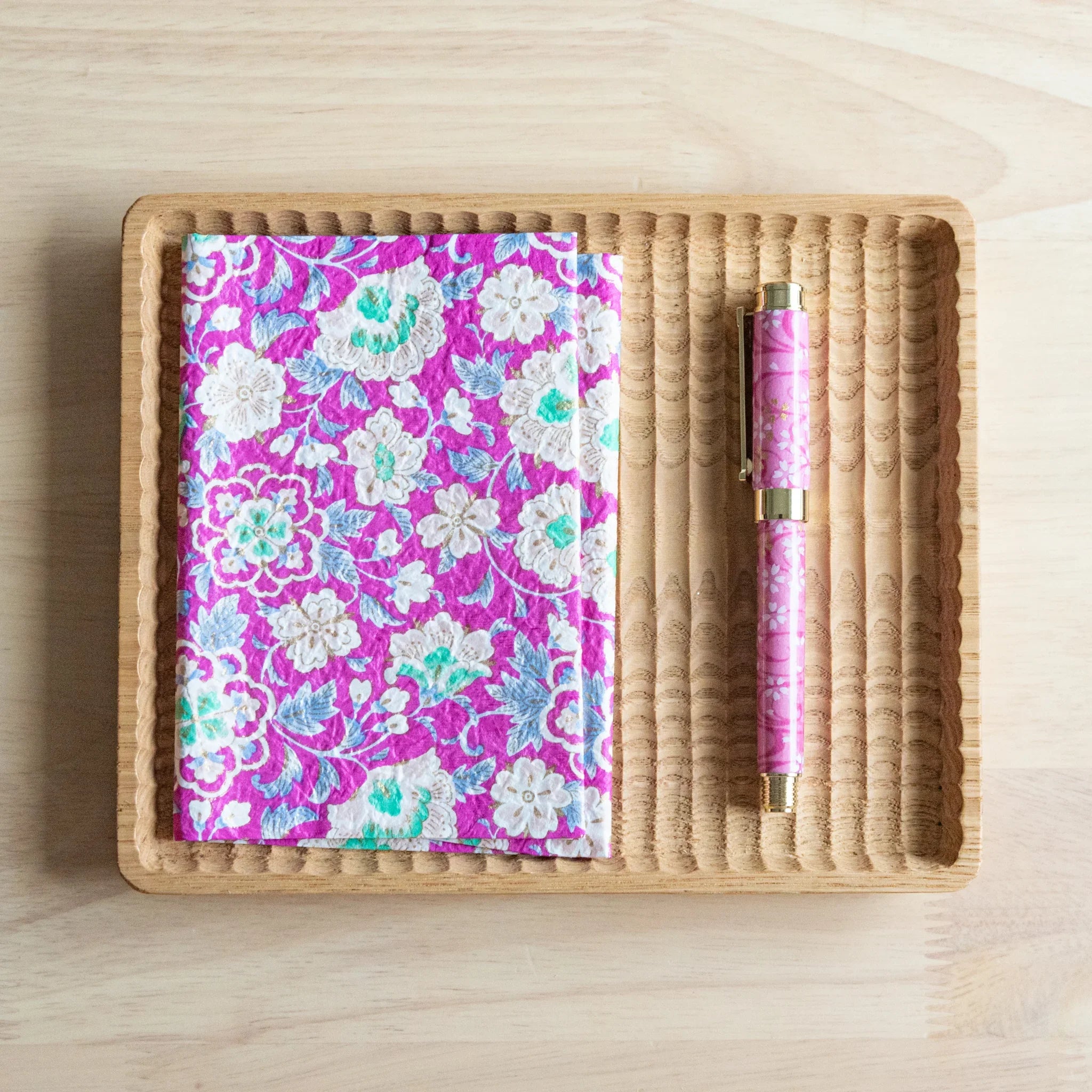 Magenta Garden yuzen washi book cover overhead showing magenta and gold tones with hand-dyed Japanese textile construction