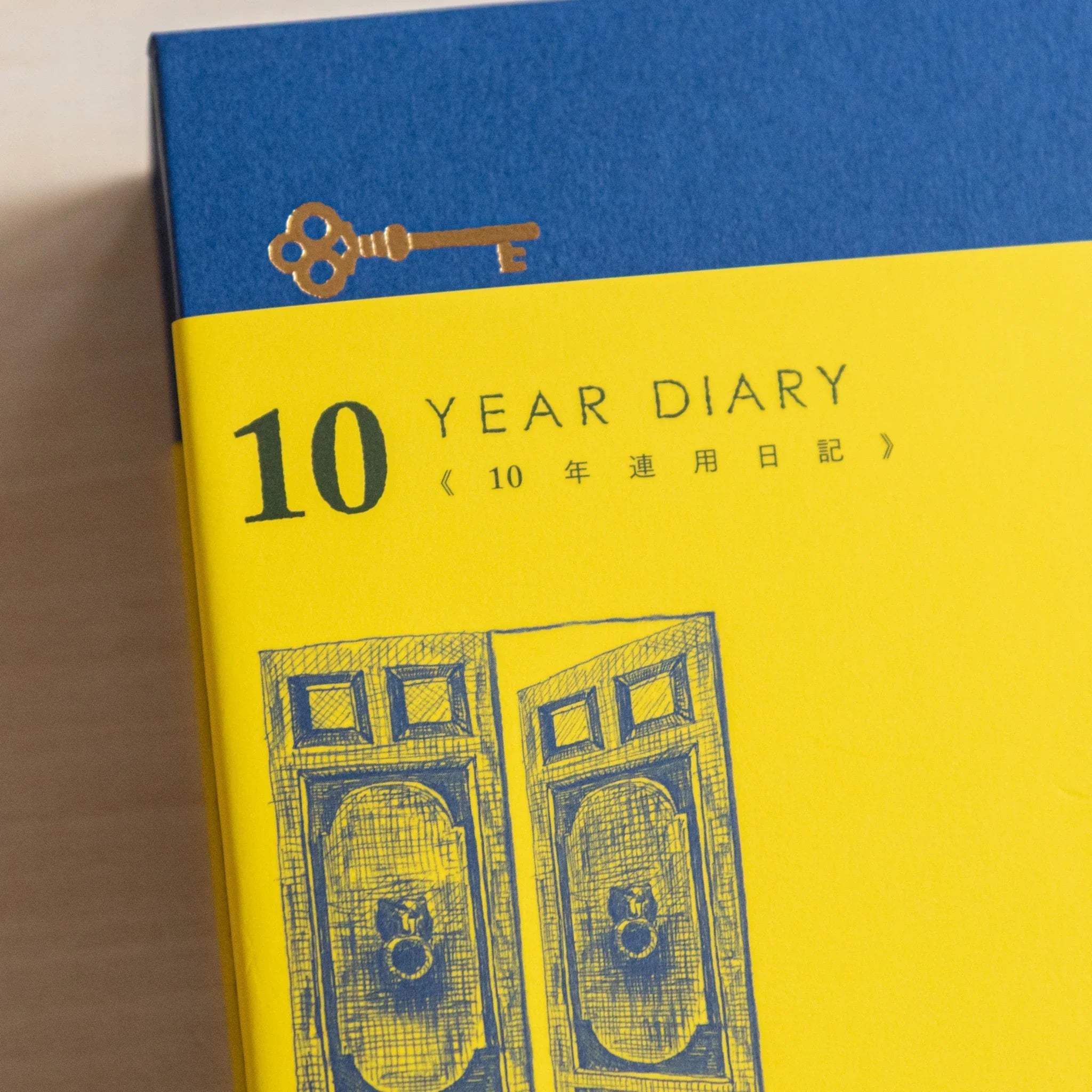 Midori 10-year journal, cover detail highlighting gate pattern embossed on hardcover, stationery item from Japan with quality